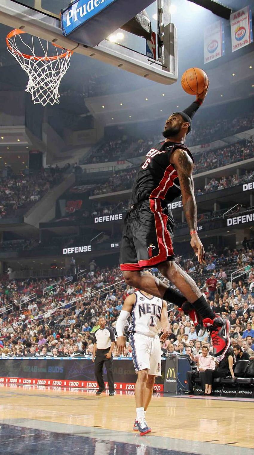 LeBron James goes up for a dunk against the Nets. - NBA