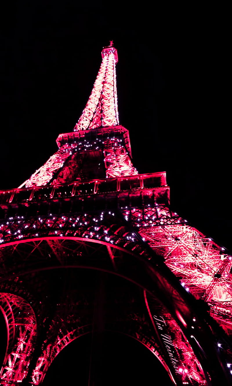 The Eiffel Tower lit up in pink. - Paris, Eiffel Tower