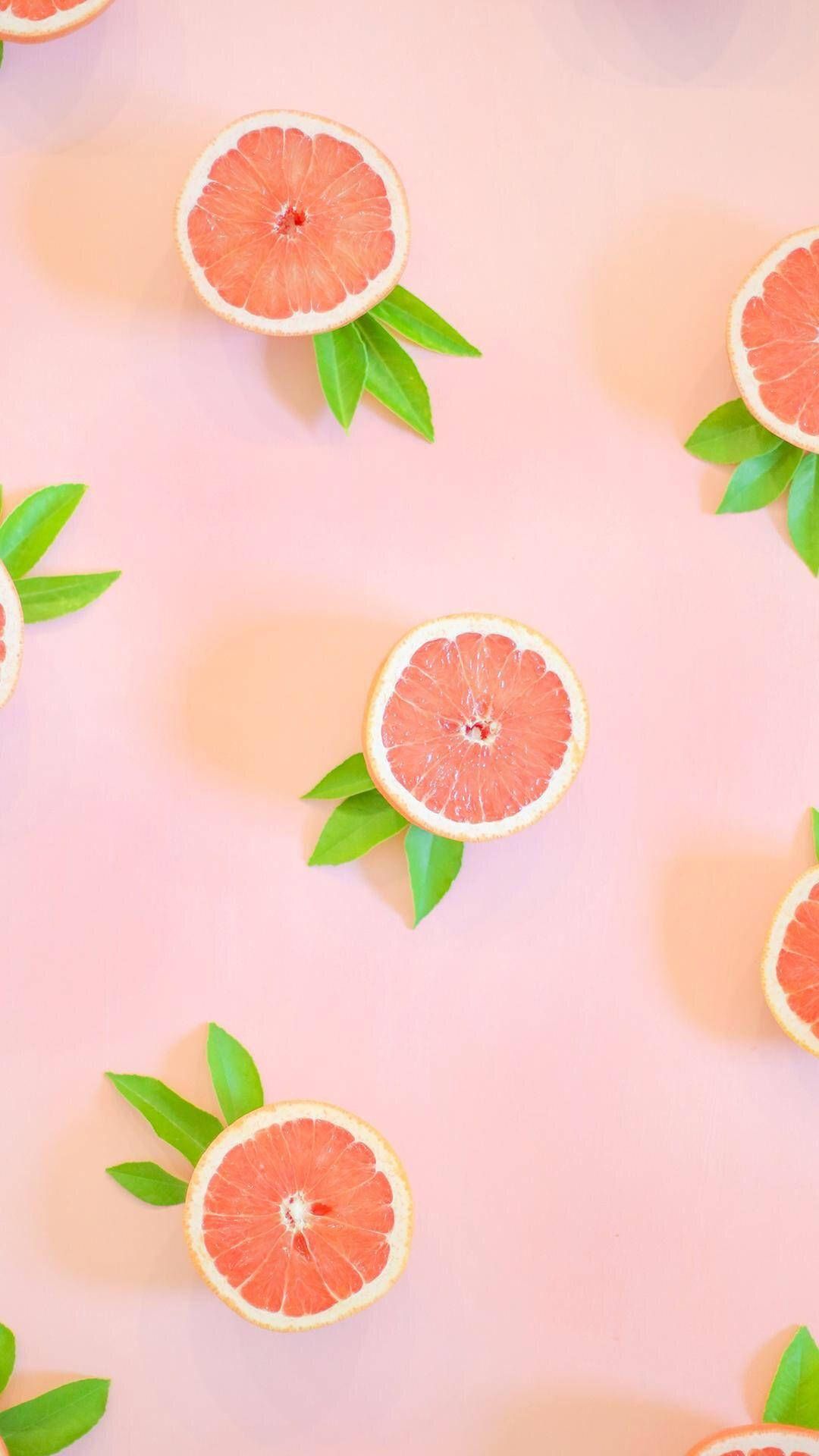 Download Aesthetic Pink Grapefruit With Leaves Wallpaper
