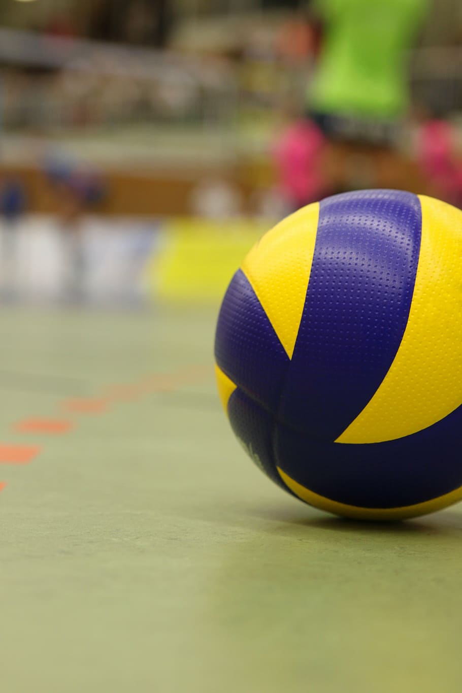 A volleyball on the floor of an arena - Volleyball