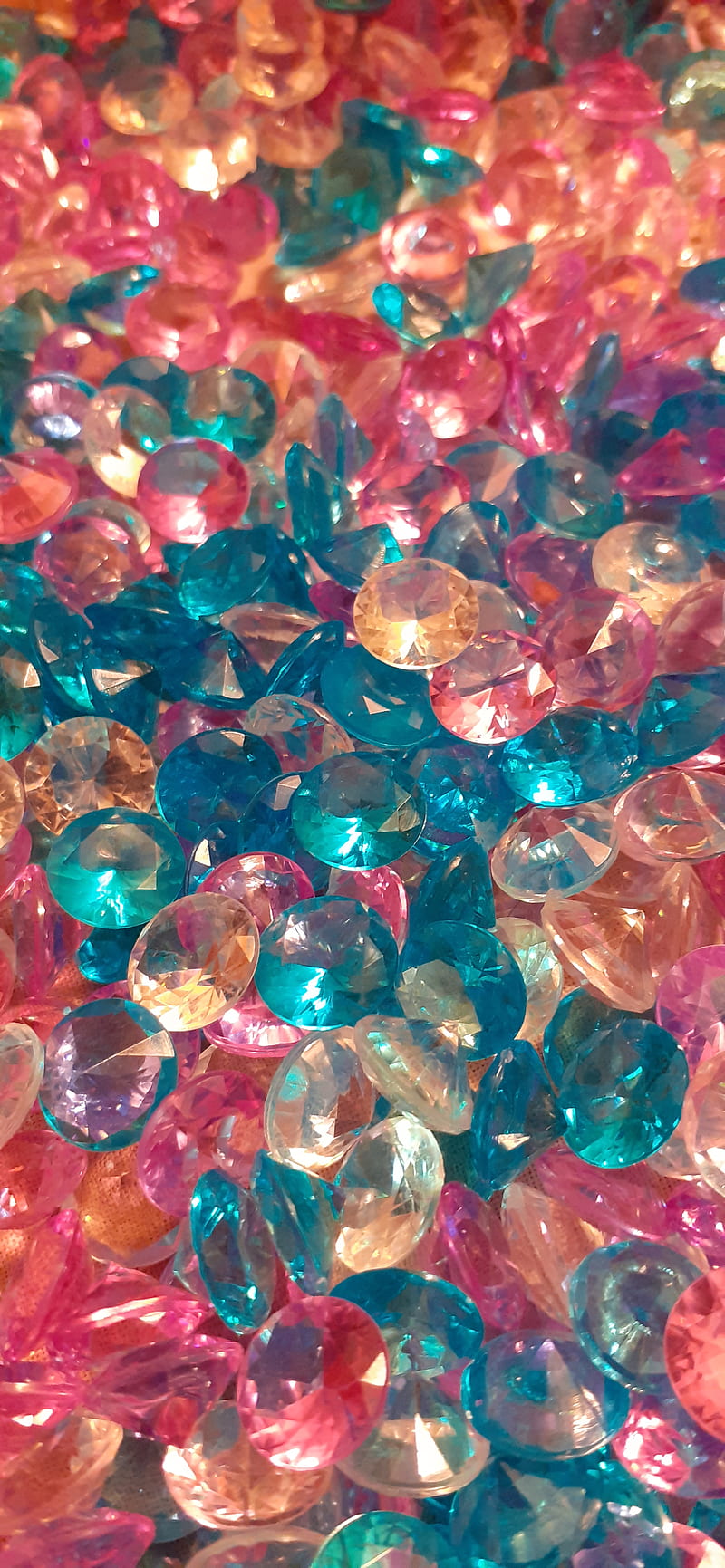 A pile of colorful plastic gems. - Diamond