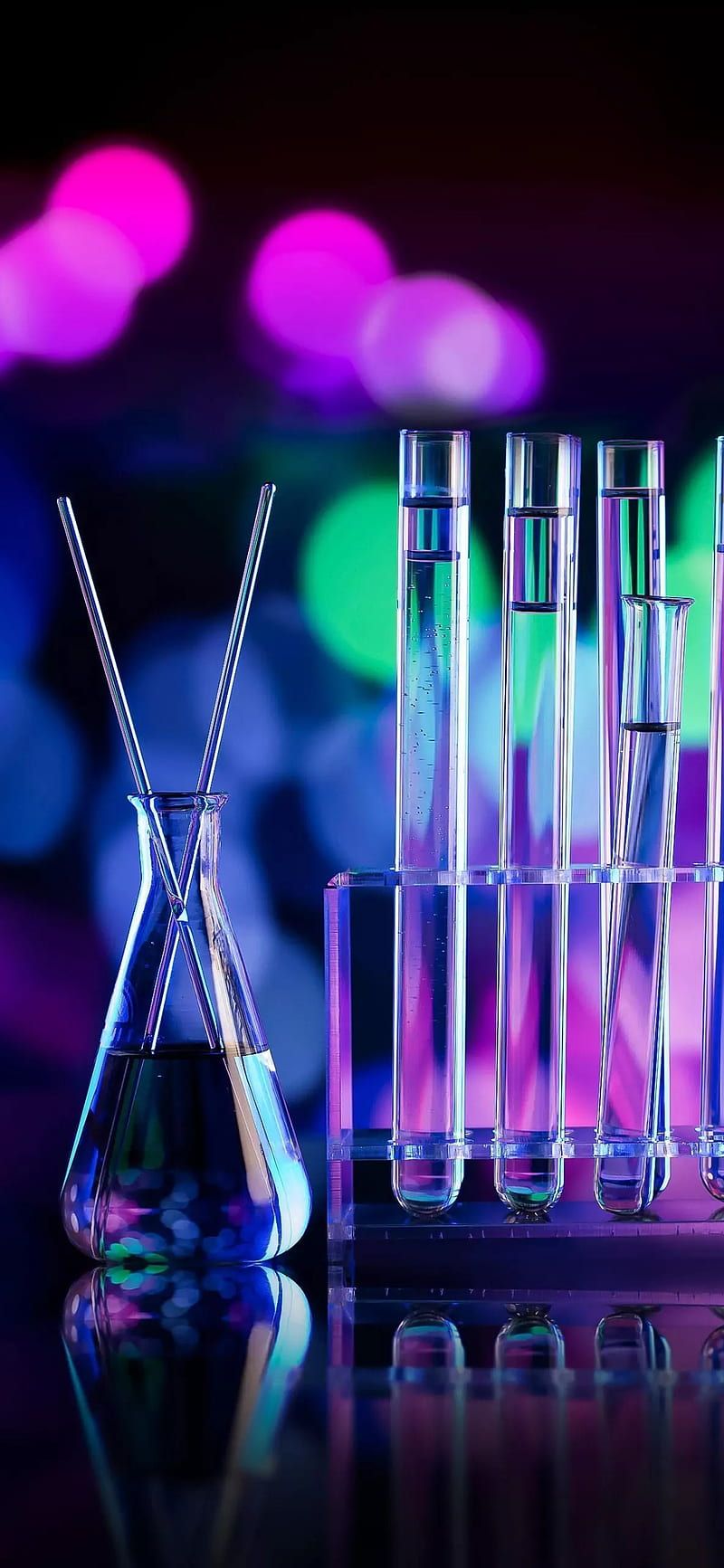 A collection of test tubes and beakers with a purple and blue background - Chemistry