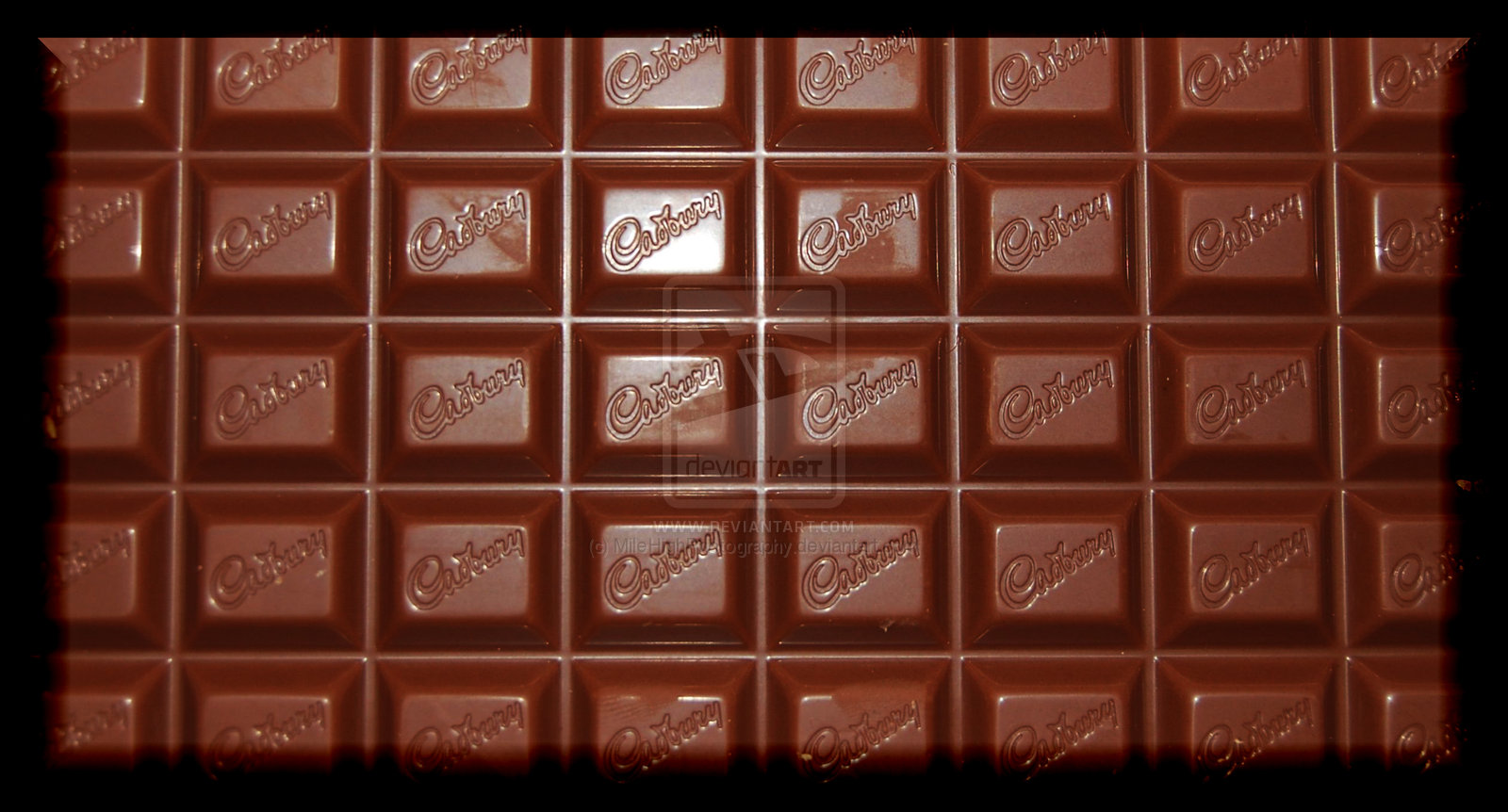 A close up of chocolate bars in squares - Chocolate