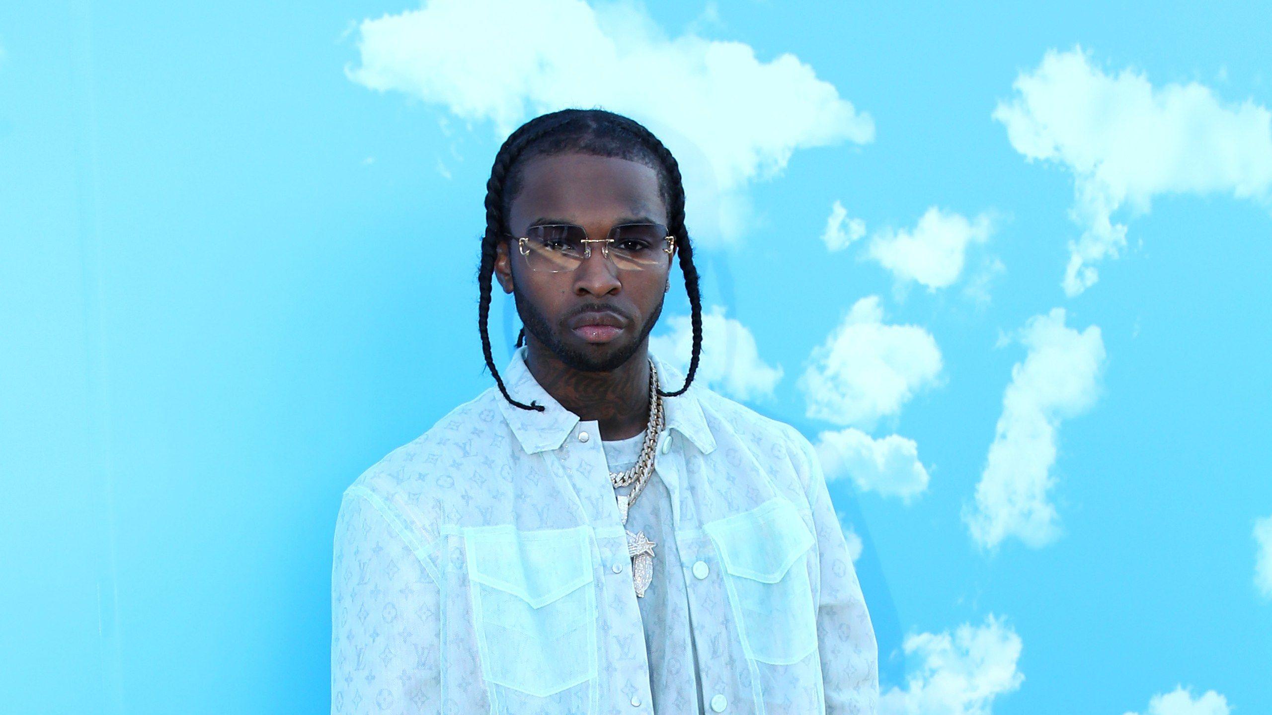 A man in glasses standing against blue clouds - Blue, Pop Smoke