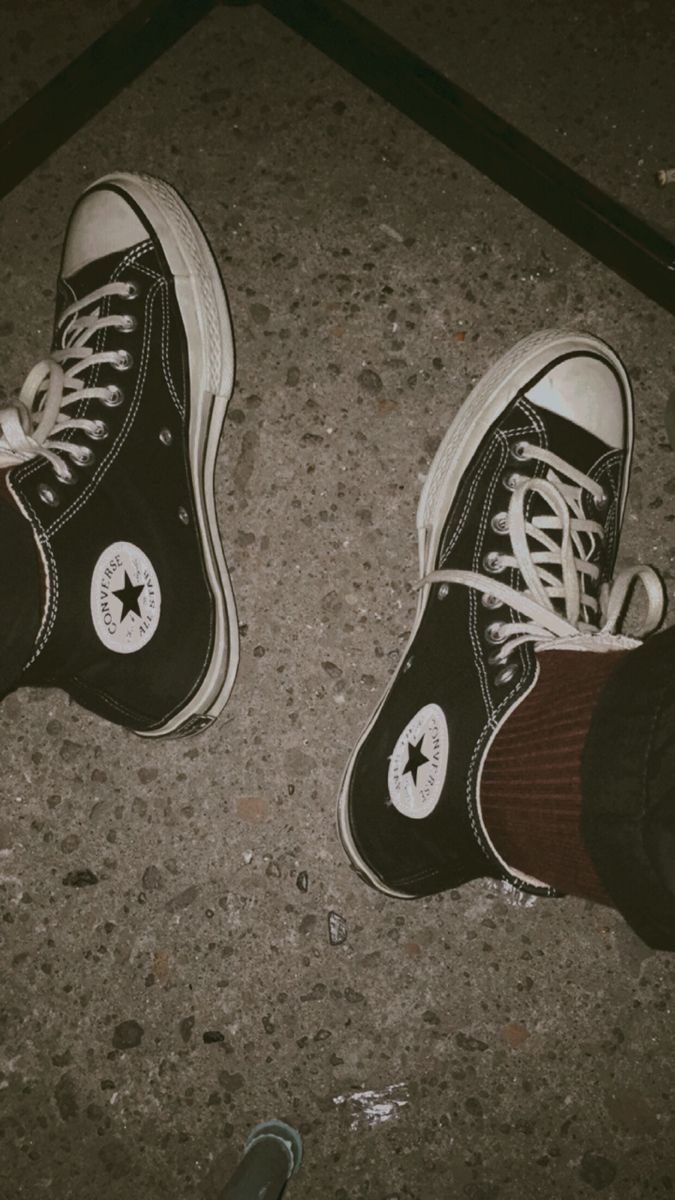 A pair of converse shoes - Converse
