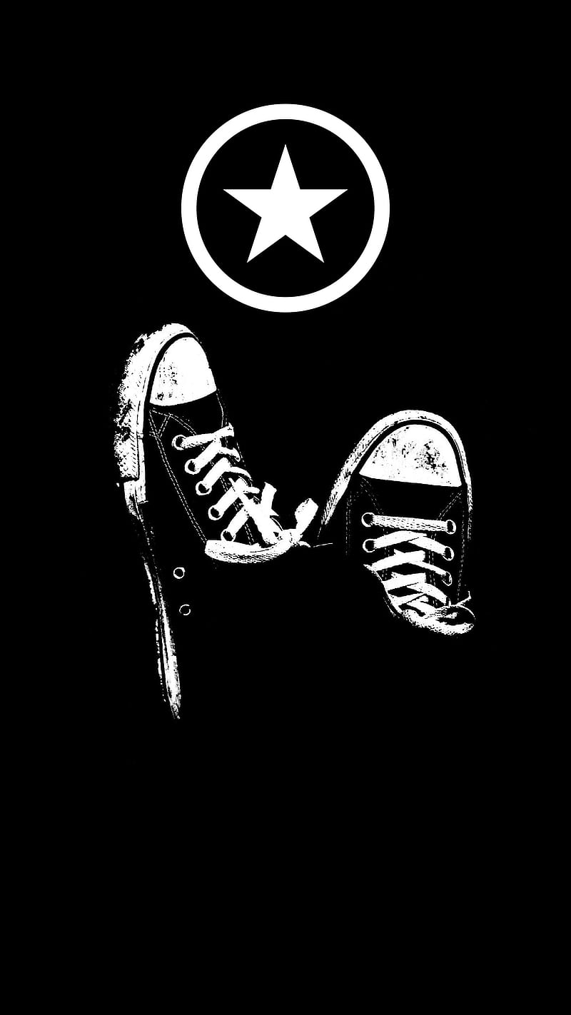 Black and white converse shoes with a star in the background - Converse