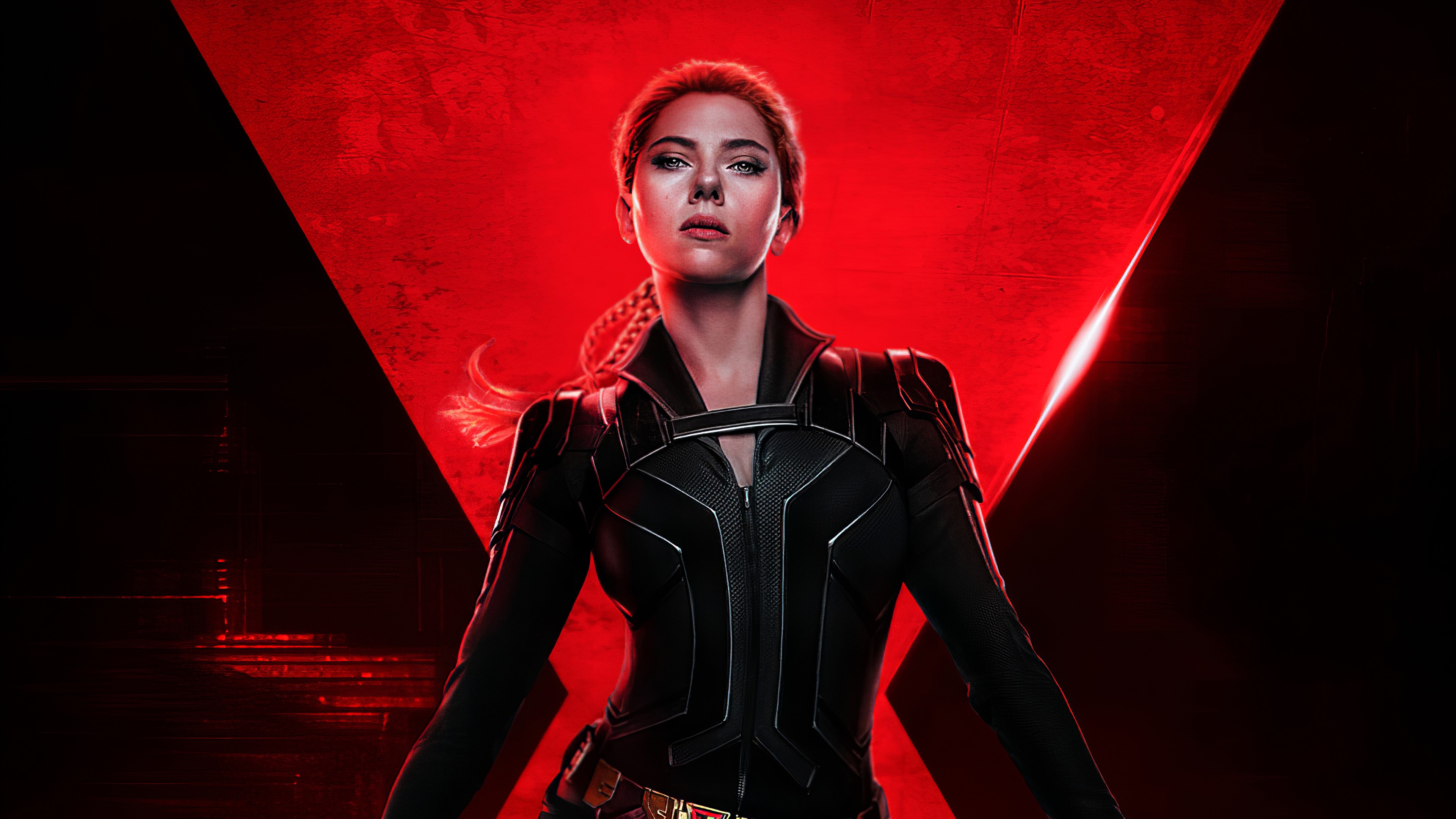 Scarlett Johansson as Black Widow in a black suit, standing in front of a red background - Avengers, Marvel