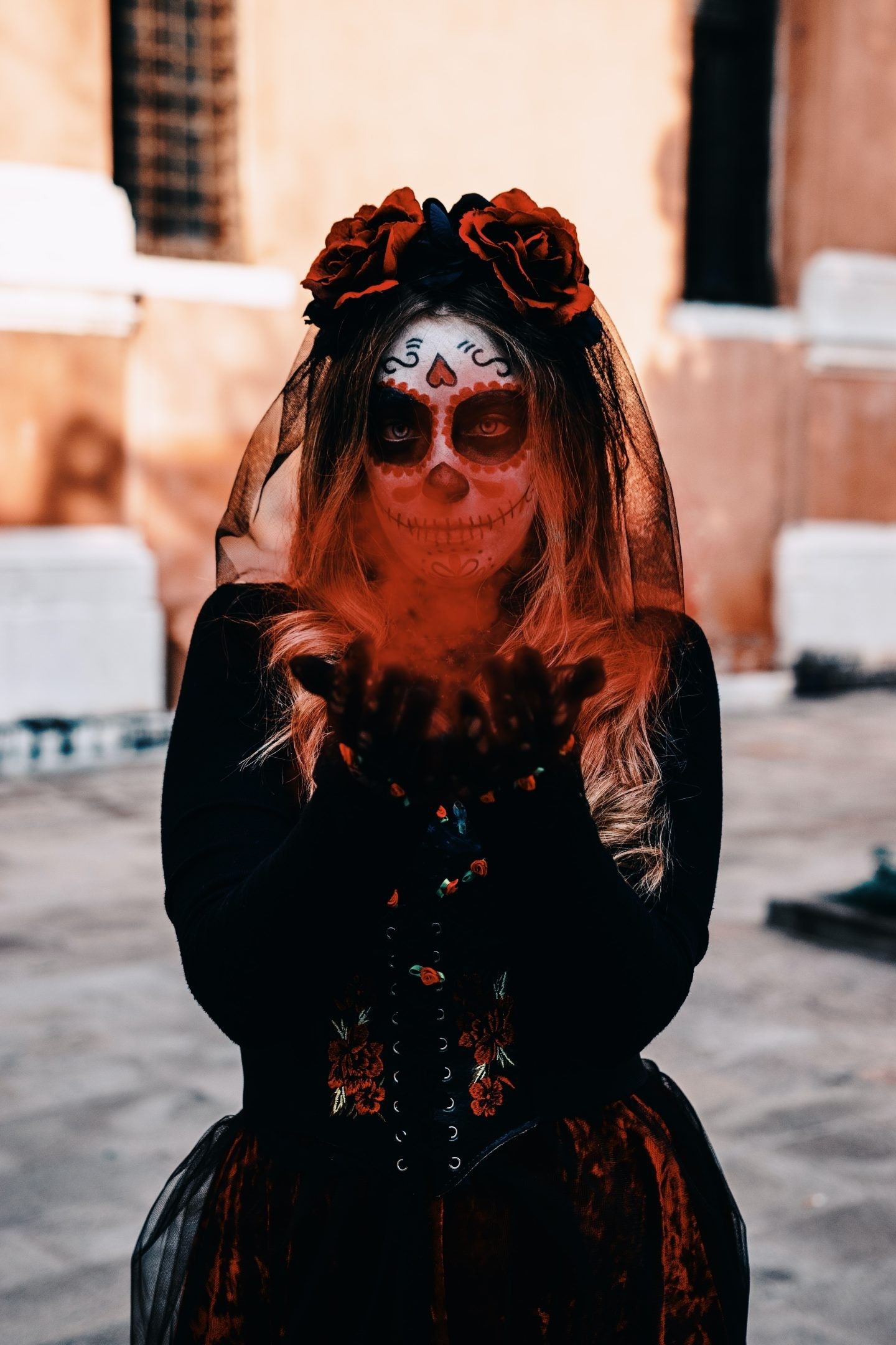 A woman with a skull makeup on her face - Halloween