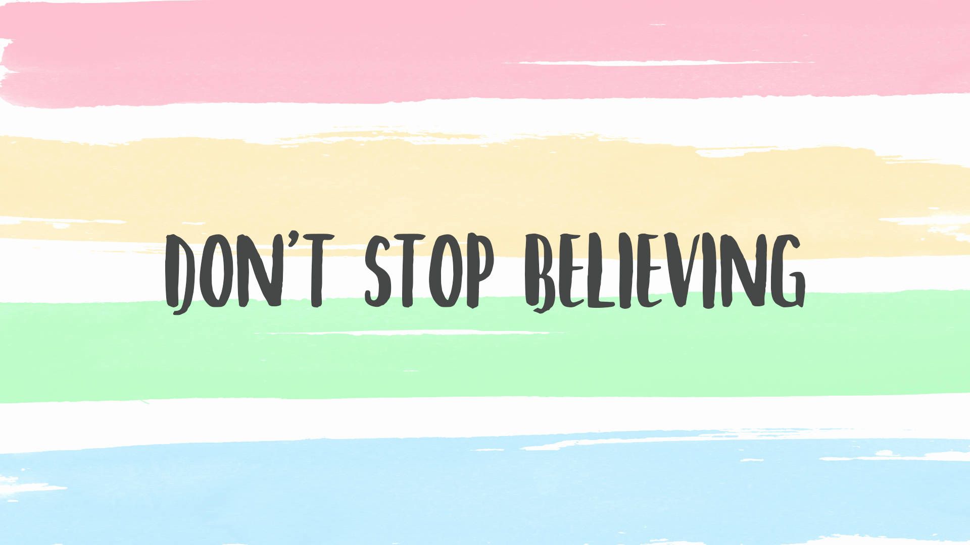 A rainbow colored background with the words don't stop believing - Laptop, pastel