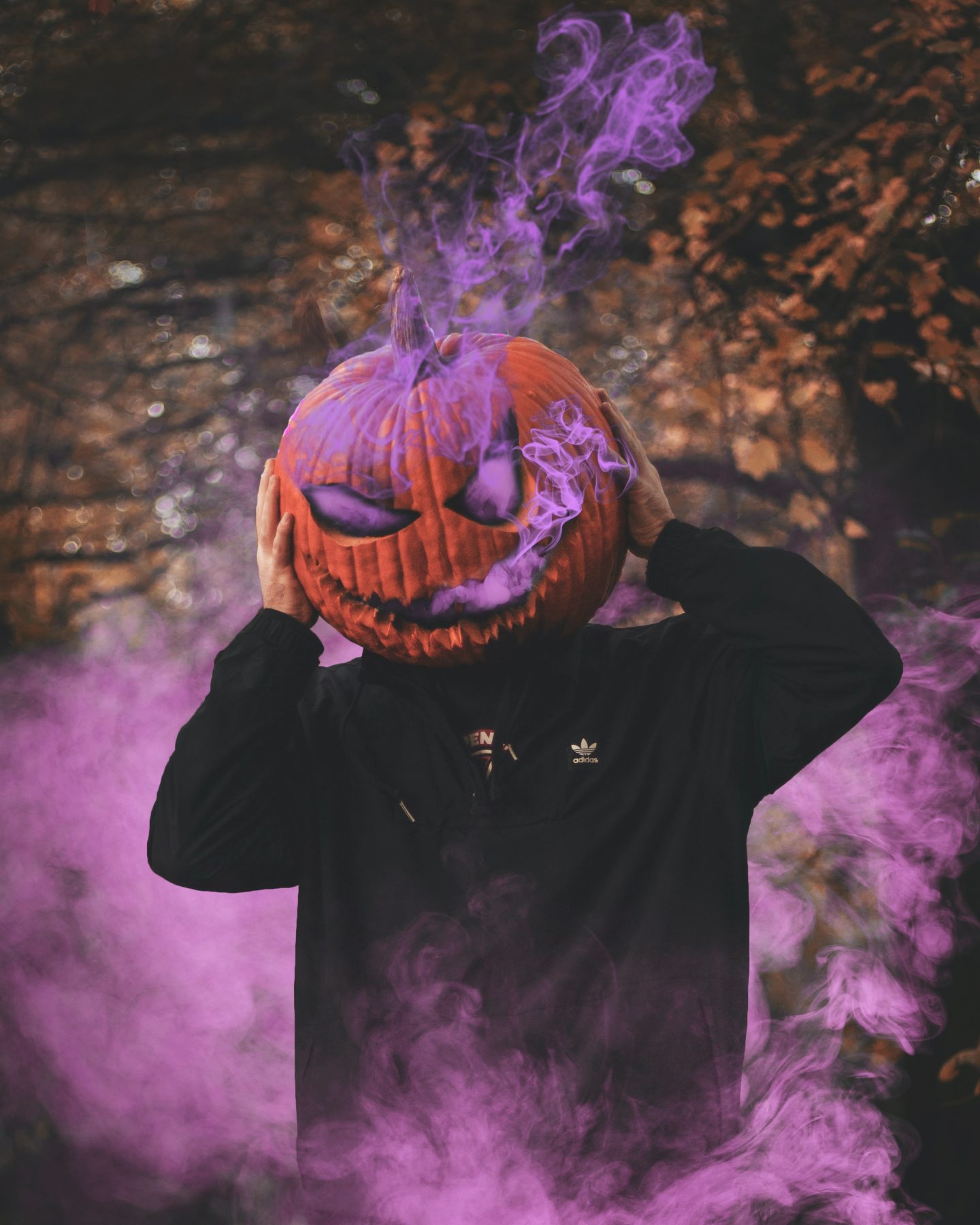 A man wearing purple smoke and holding his head - Halloween, cute Halloween, spooky