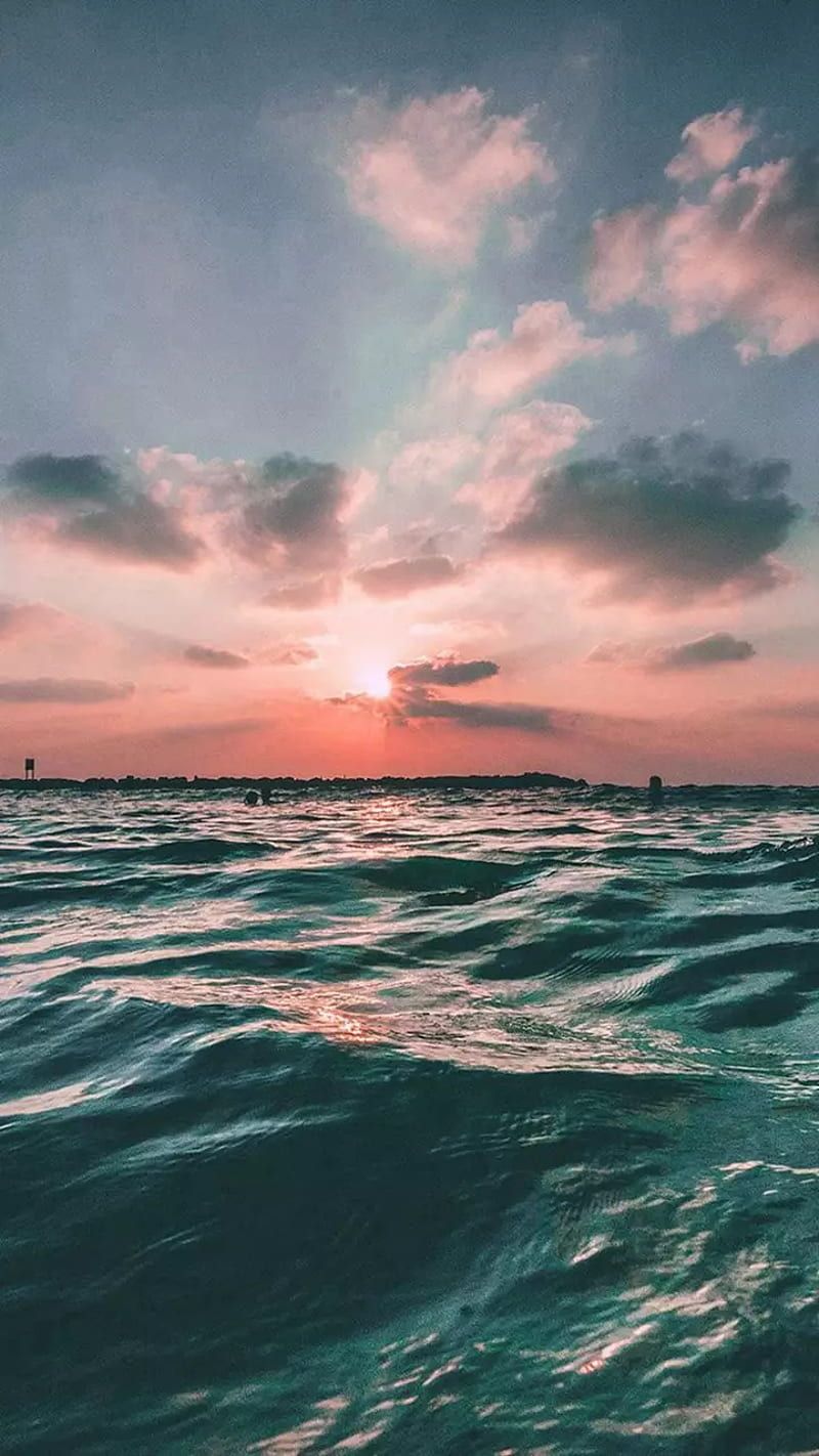 A sunset over the ocean with waves - Wave, beach, ocean