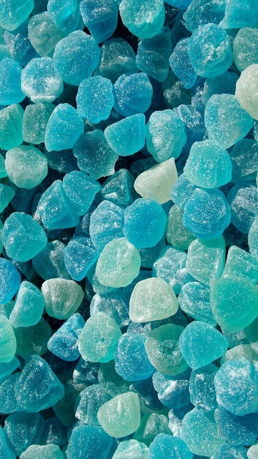 A close up of blue rocks on the ground - Cyan