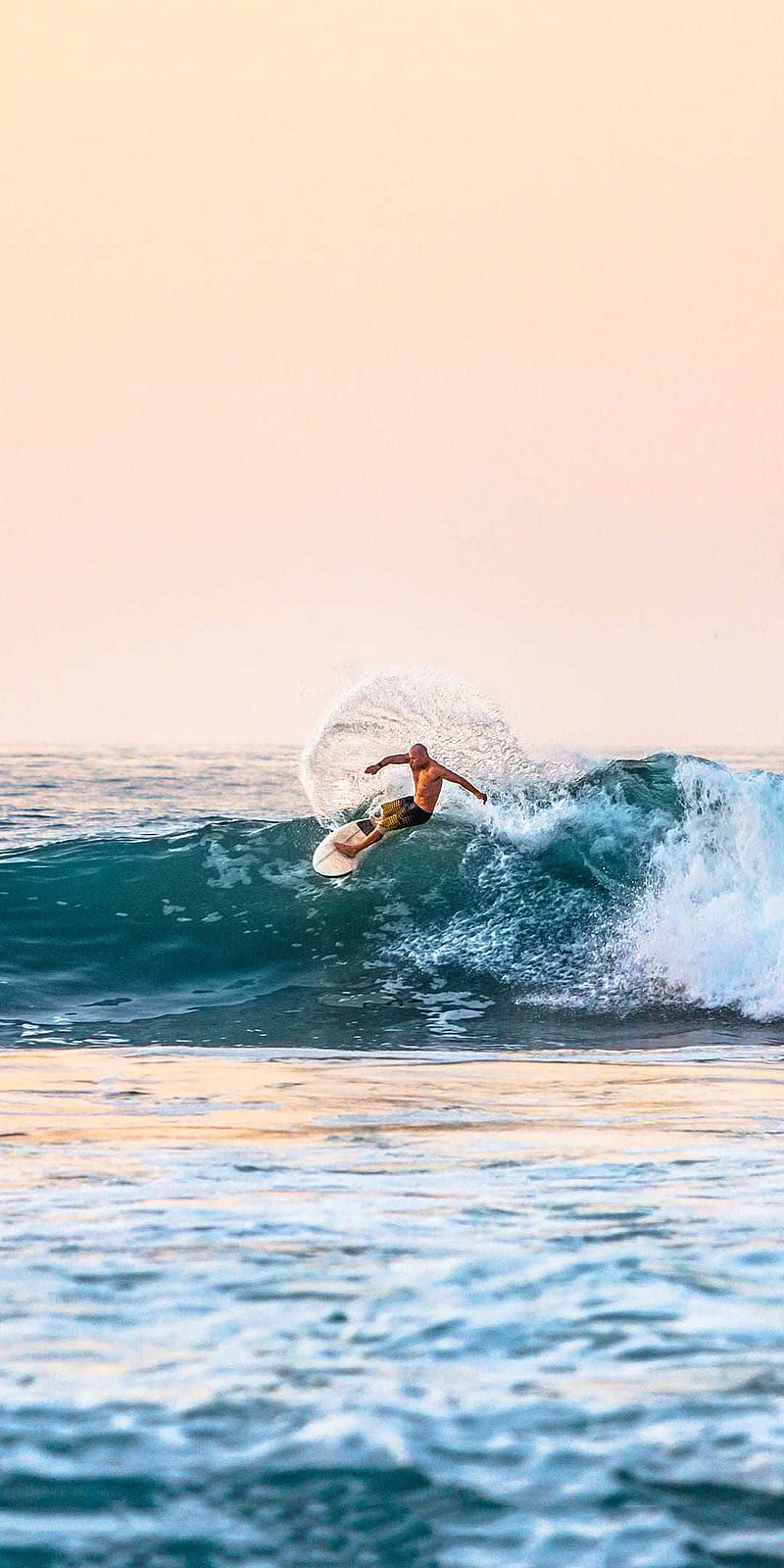 A person riding on top of the water - Surf