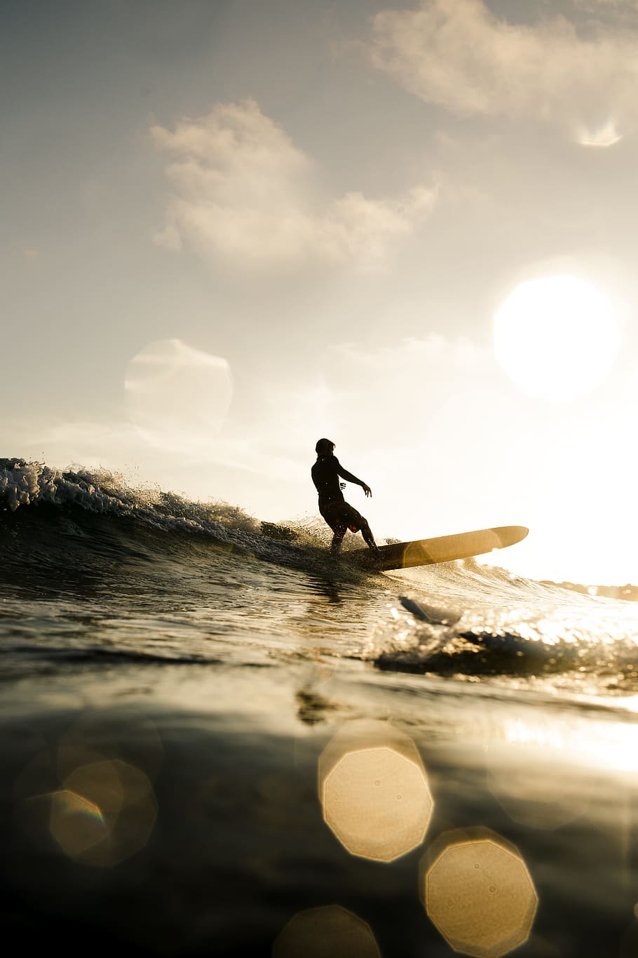 HD wallpaper: person surfing on wave, surfer, longboard, silhouette, yellow
