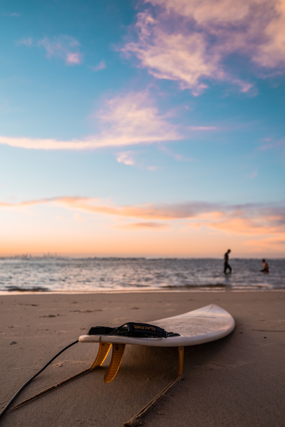 person standing on beach during sunset photo