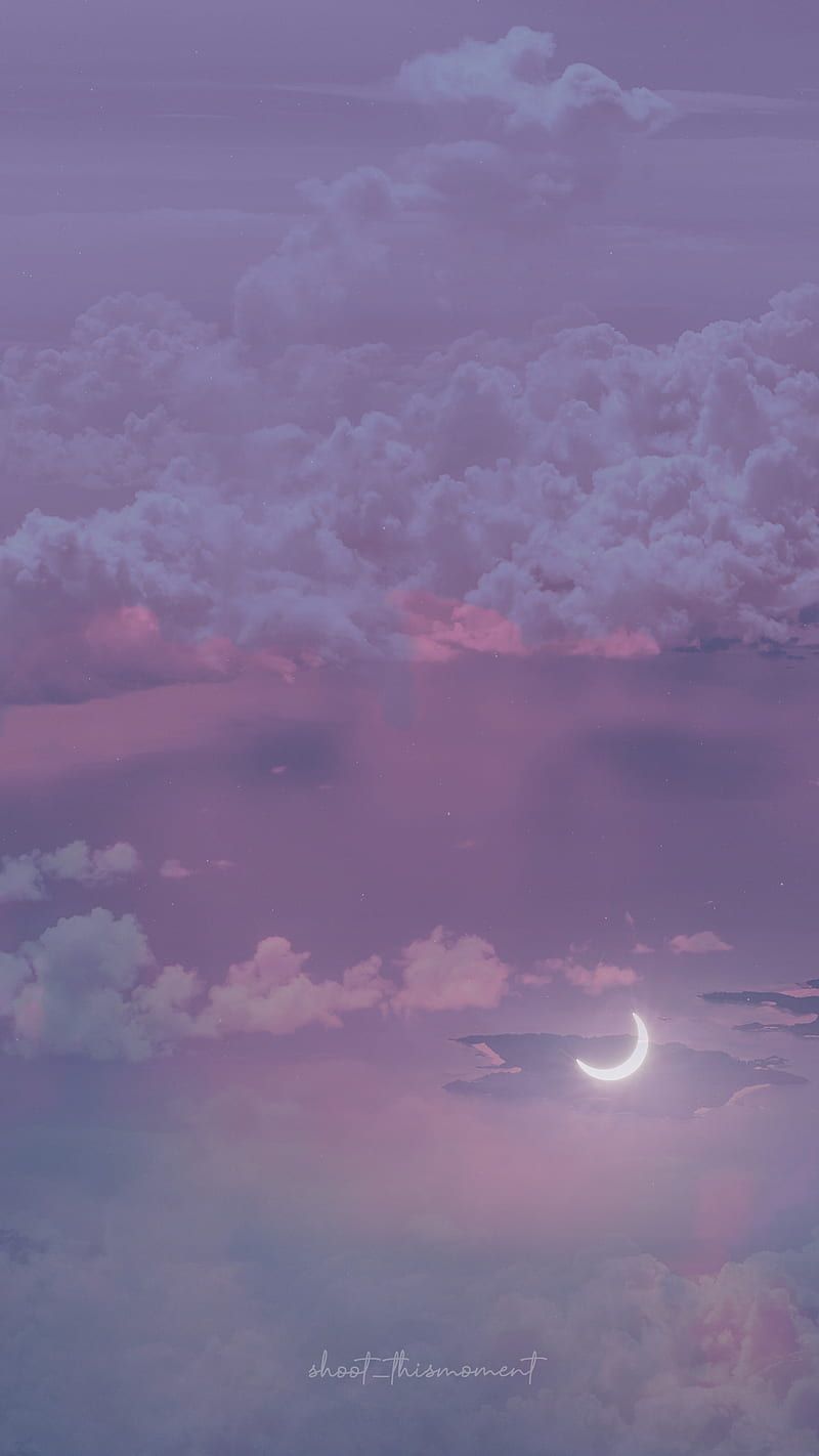 A purple sky with clouds and the moon - Magic