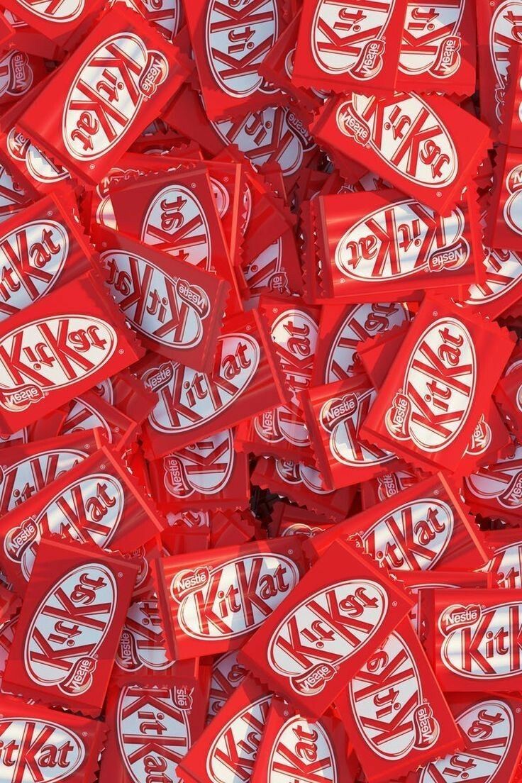 A pile of red Kit Kat candy bars - Chocolate