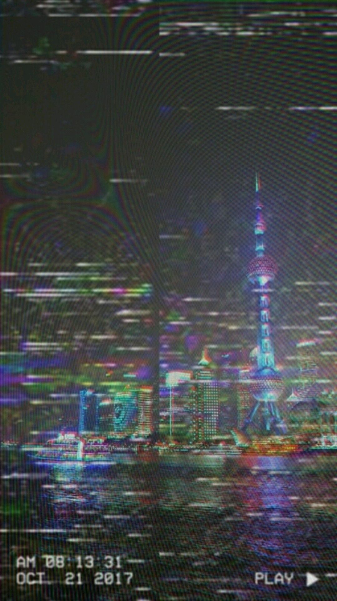 A picture of a city at night with a digital effect - VHS
