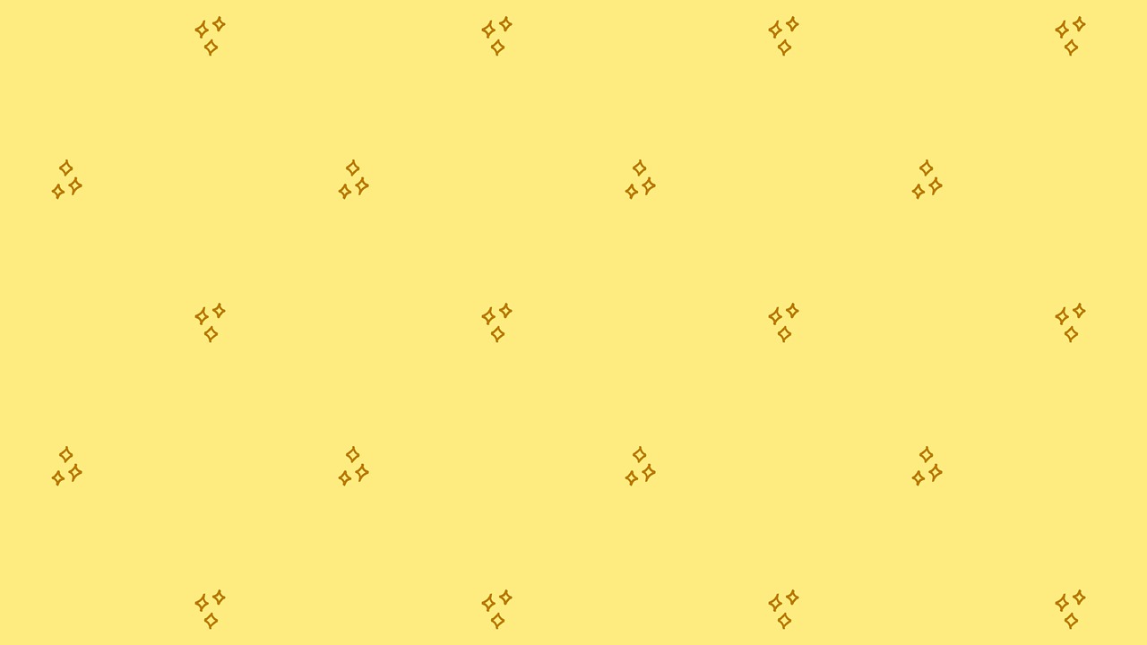 A yellow background with small brown dots - Pastel yellow