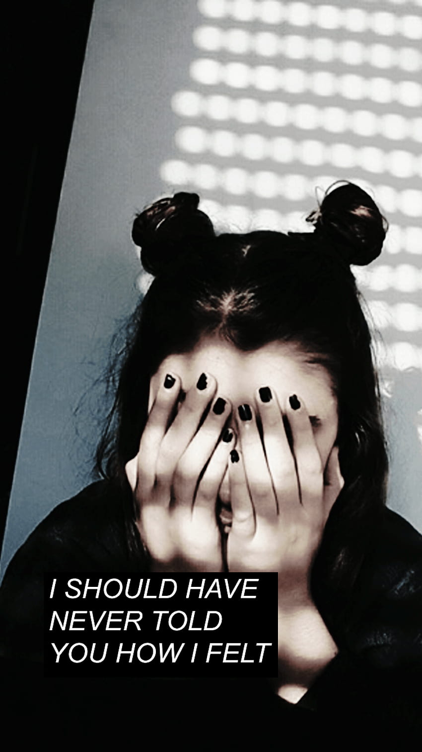 Aesthetic phone wallpaper of a girl with black nails covering her face with her hands - Grunge