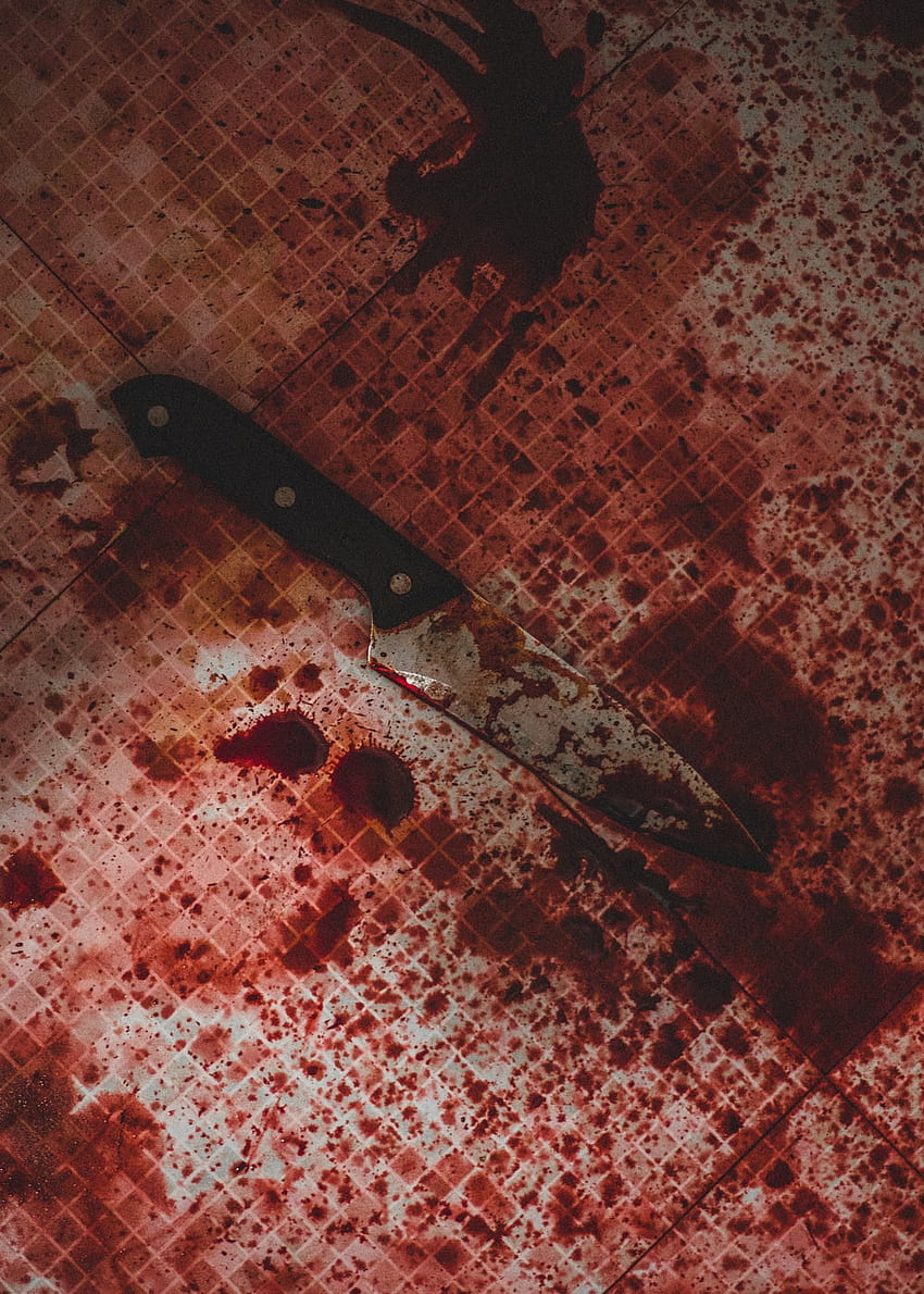 A knife on the floor with blood all around it - Blood