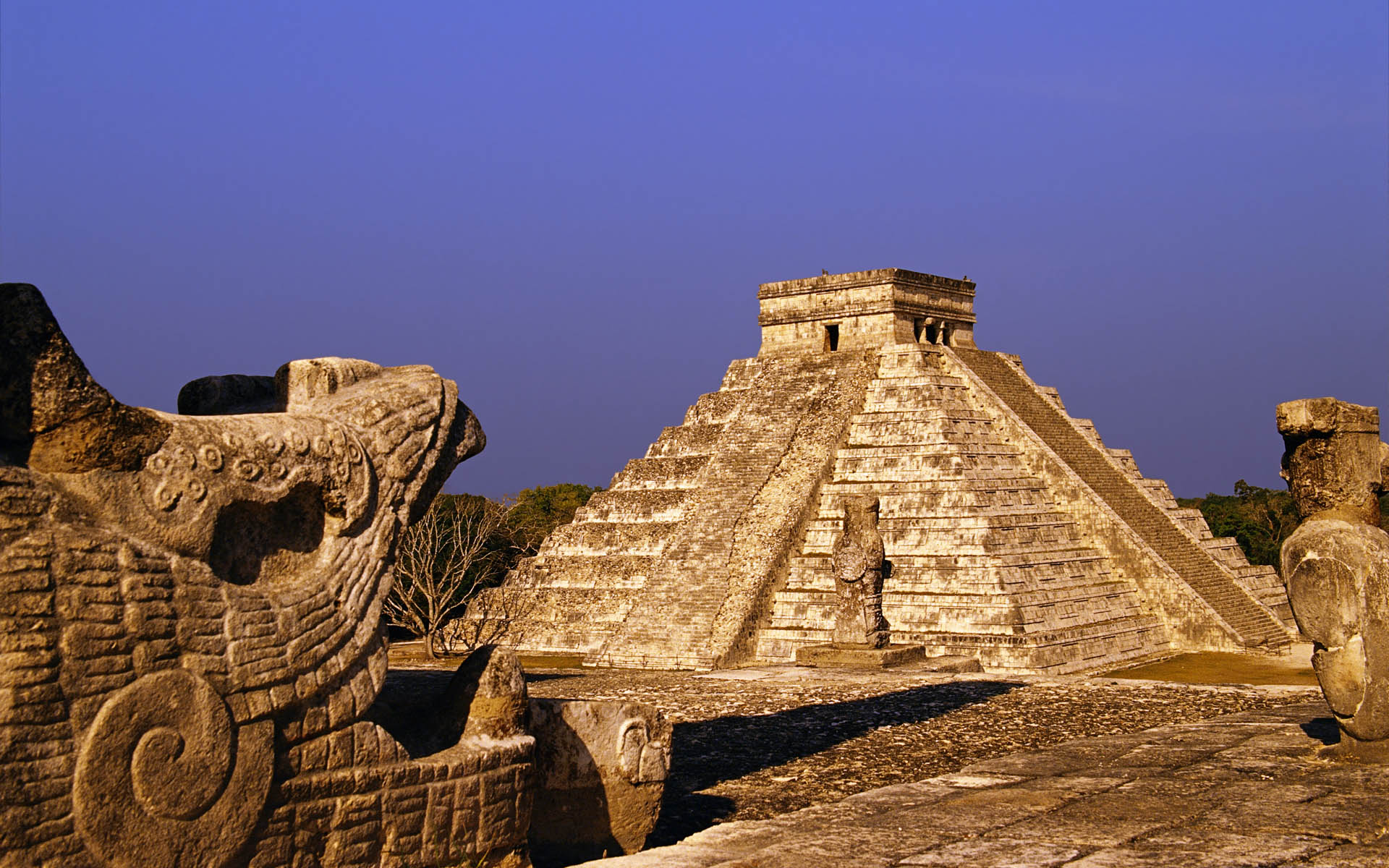 The pyramid of Kukulkan, also known as El Castillo, stands in the center of the ancient city of Chichen Itza. - Mexico