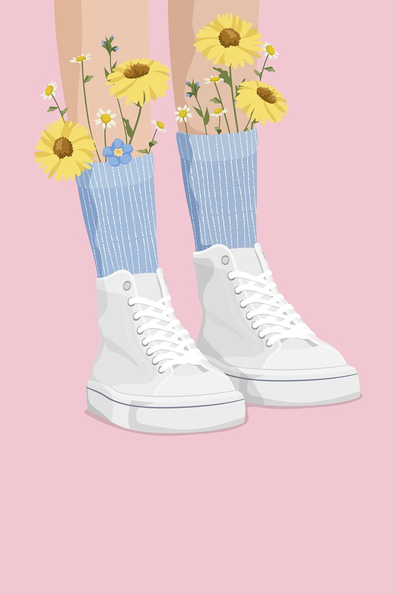 A pair of feet wearing white high top sneakers and socks with flowers growing out of them. - Shoes