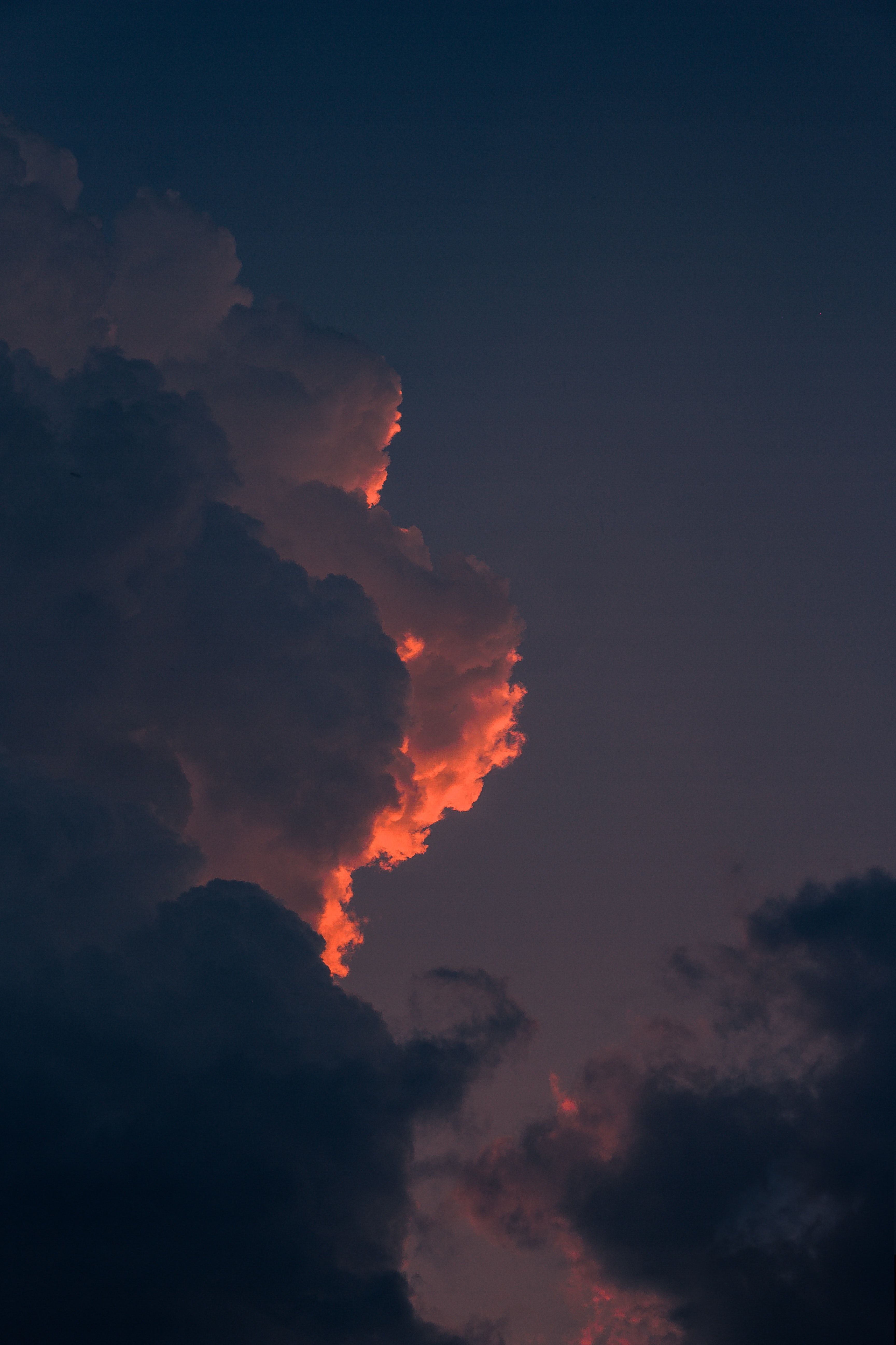 A cloud formation in the sky at sunset. - Sky, sunrise, cloud