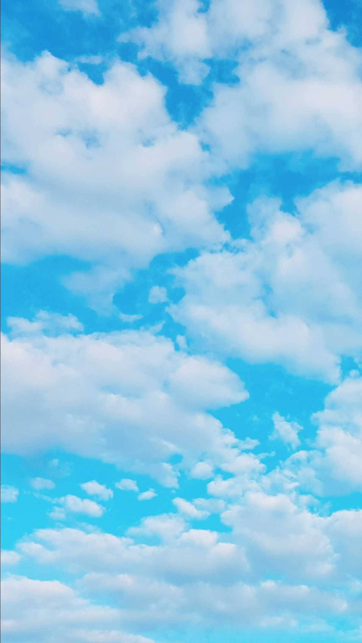 A blue sky with white clouds. - Sky, pastel blue, light blue