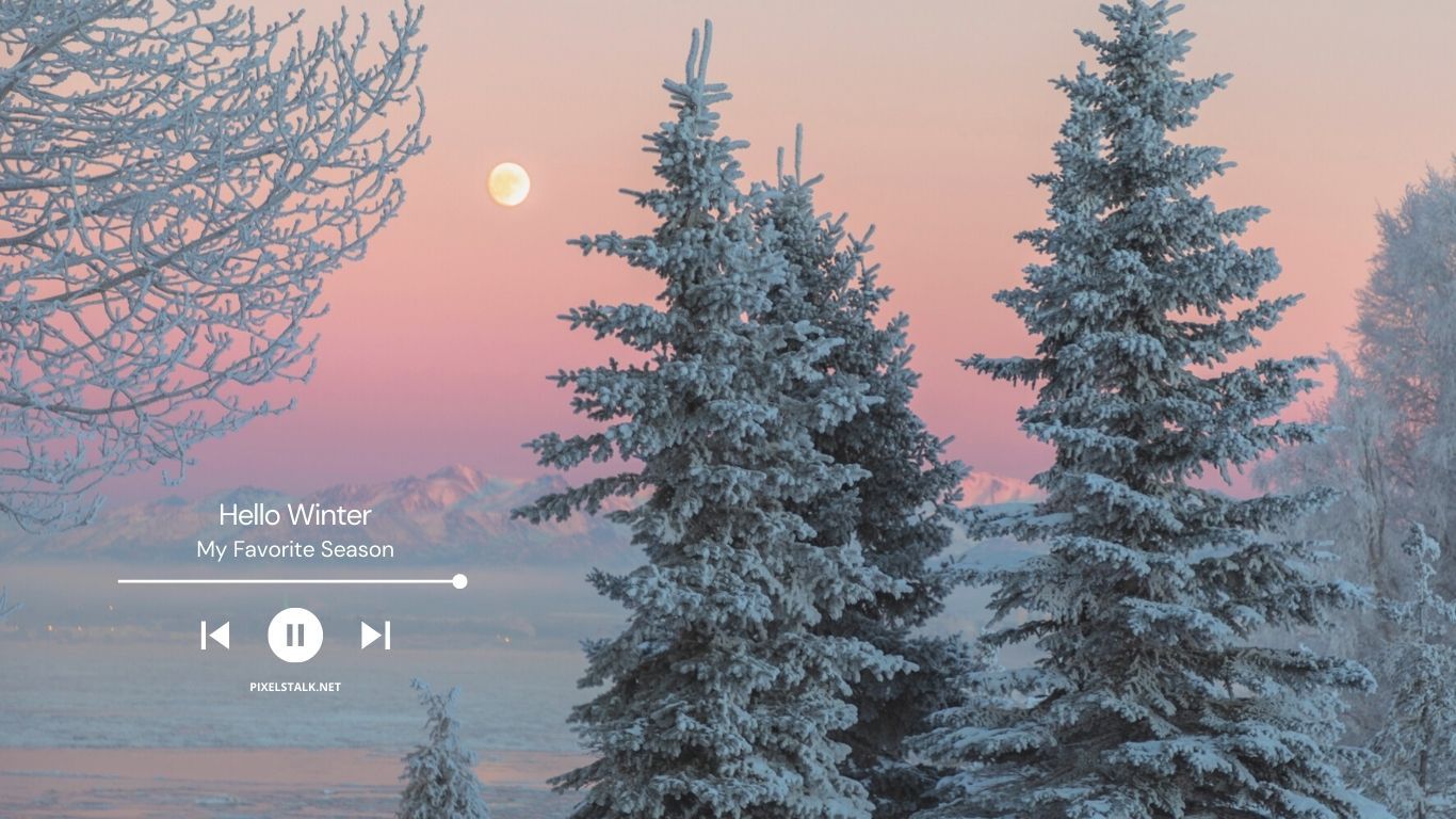 A computer screen with snowy trees and pink sky - 1366x768