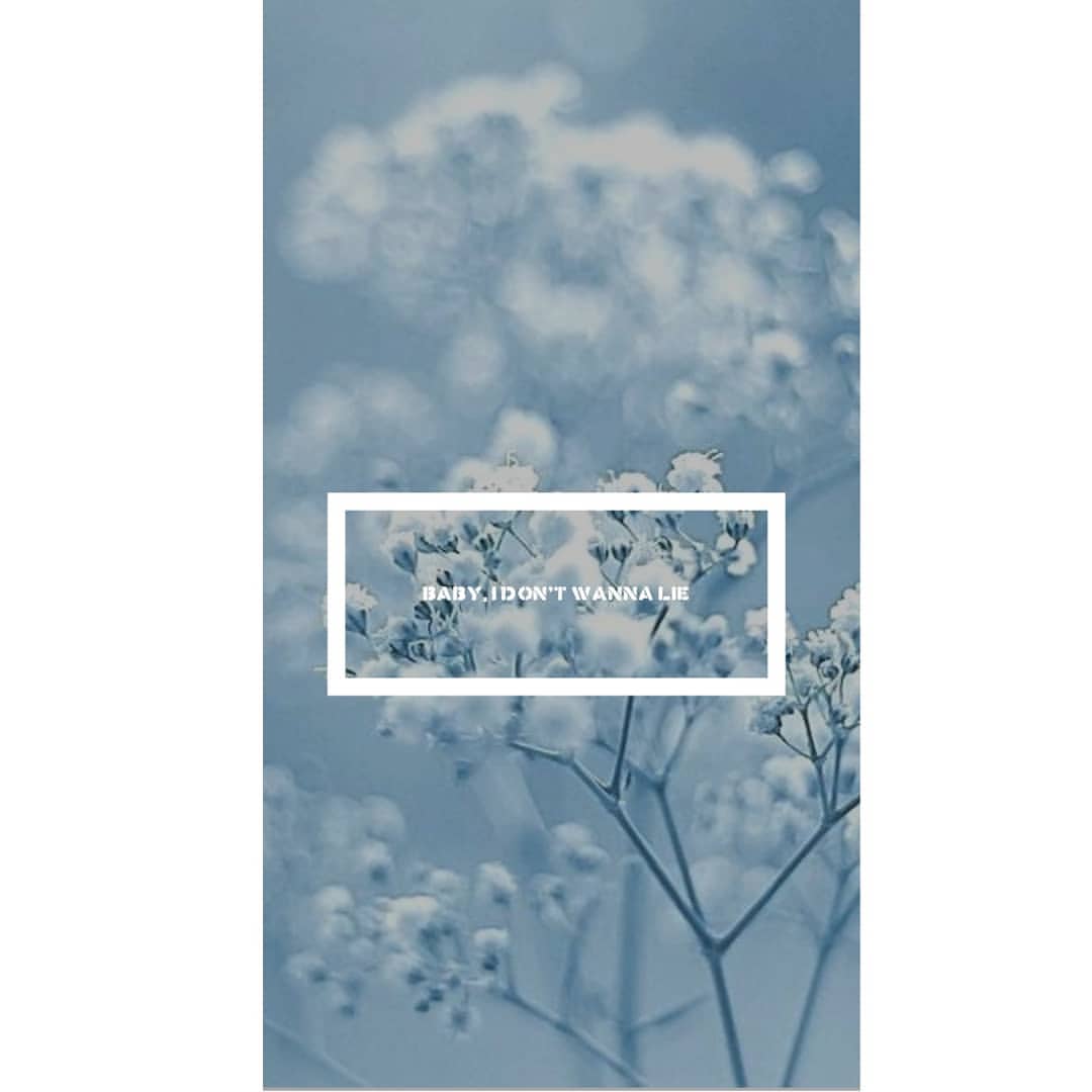 A blue background with white flowers and text - Profile picture
