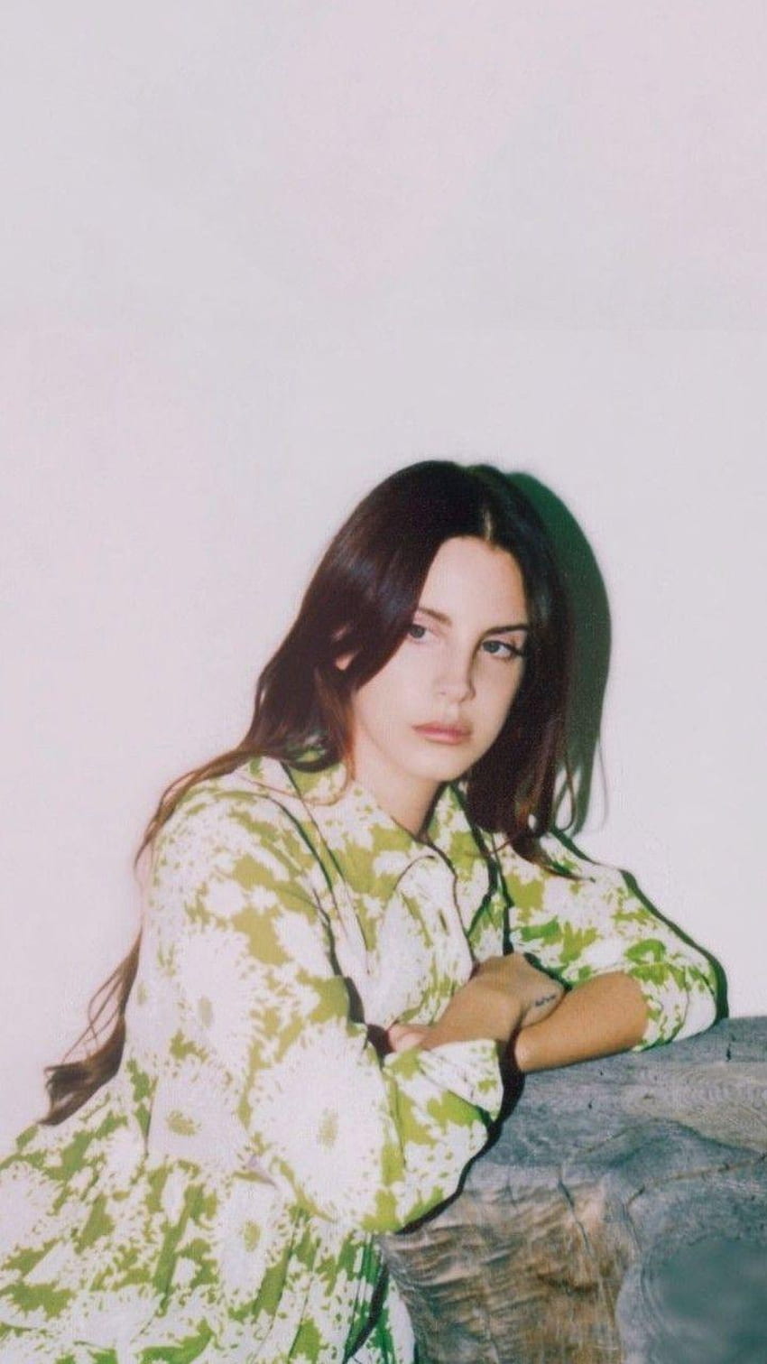 A woman in green dress posing for the camera - Lana Del Rey