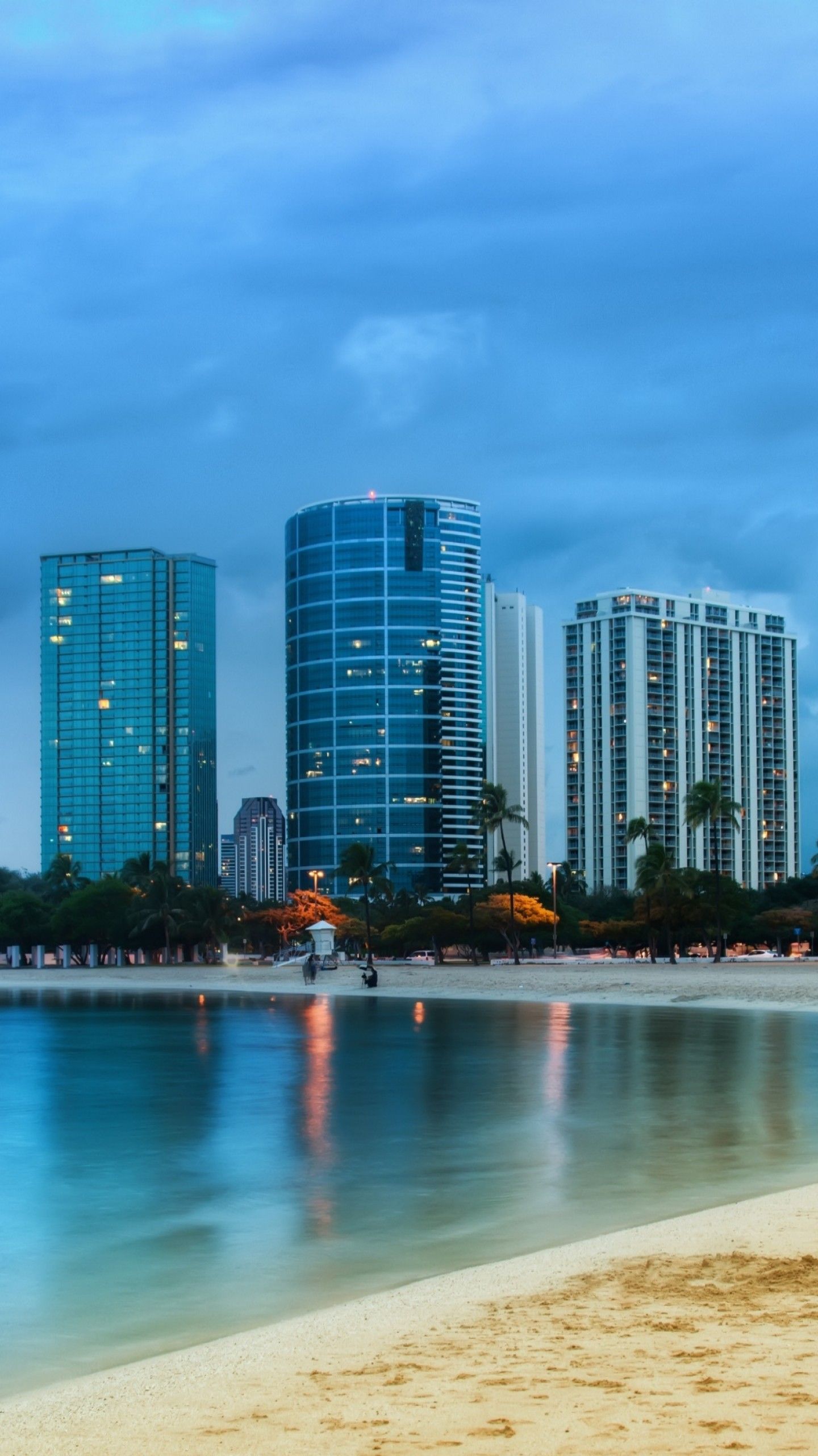 A beach with buildings in the background - Beach, Miami
