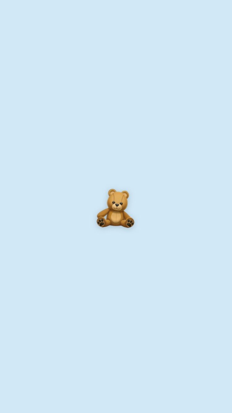 A cute brown teddy bear sitting on a blue background - Teddy bear