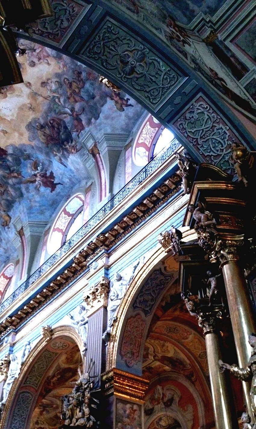 A church with a painted ceiling and columns. - Architecture