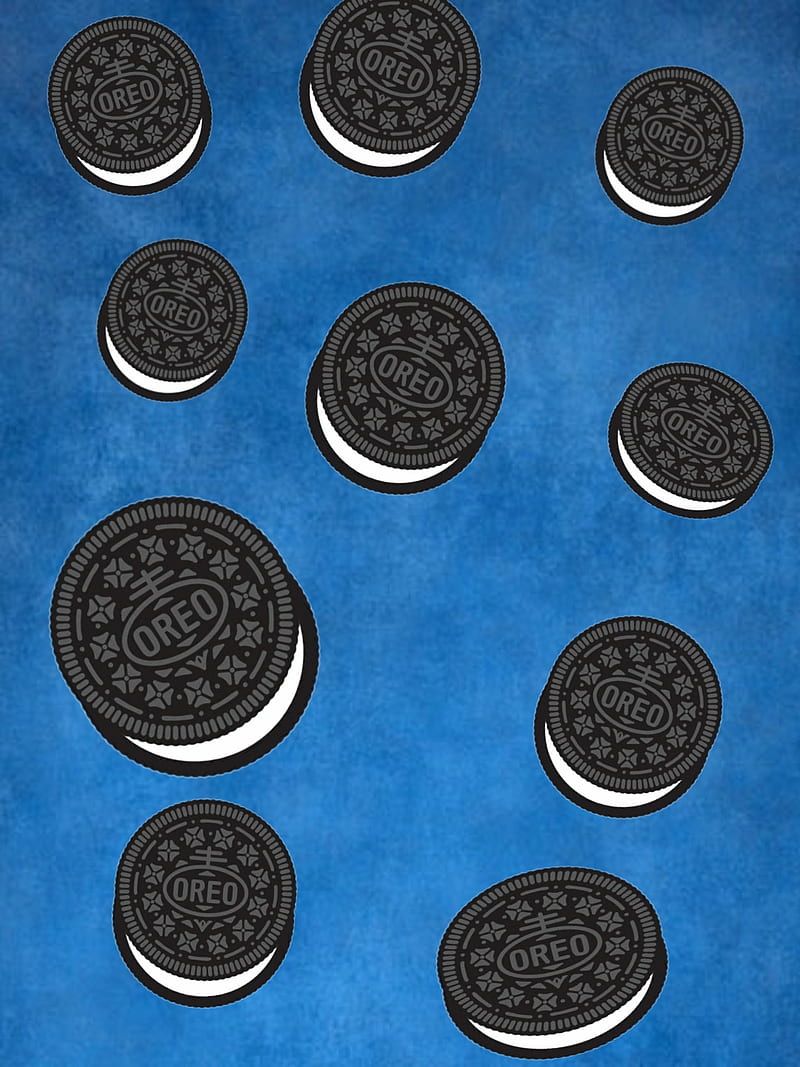 Oreo cookies are falling on a blue background - Oreo