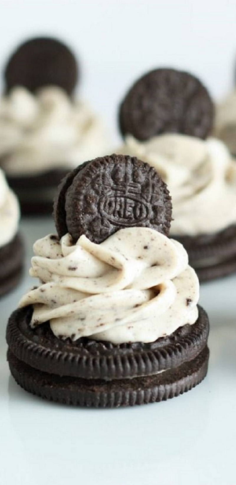 A close up of cookies with cream frosting - Oreo