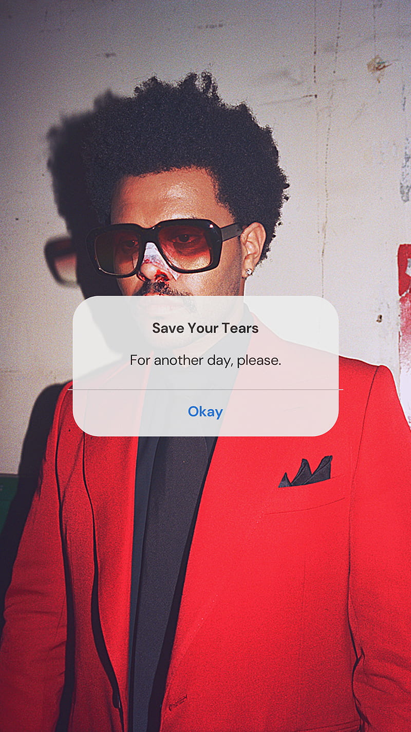 A man in red suit with glasses - The Weeknd