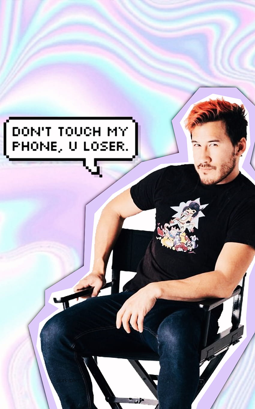 A man sitting in the chair with text on it - Markiplier