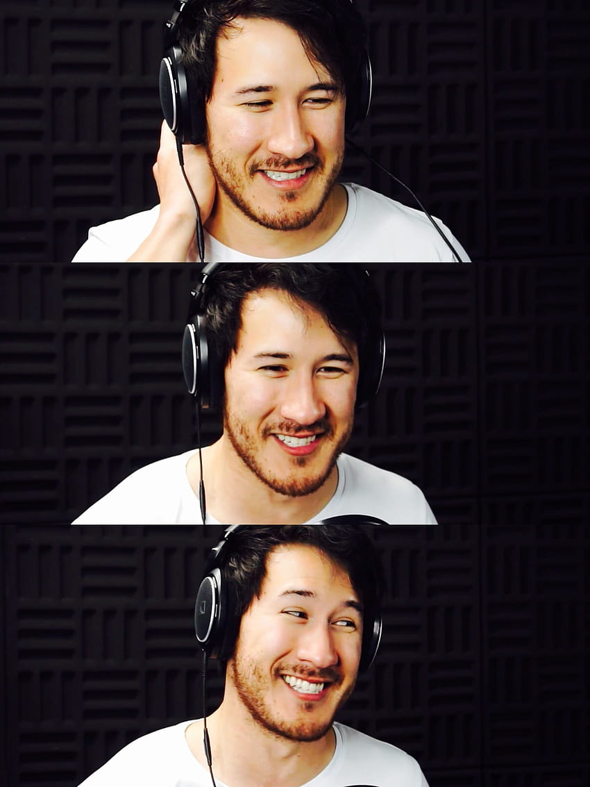 A man wearing headphones and smiling - Markiplier