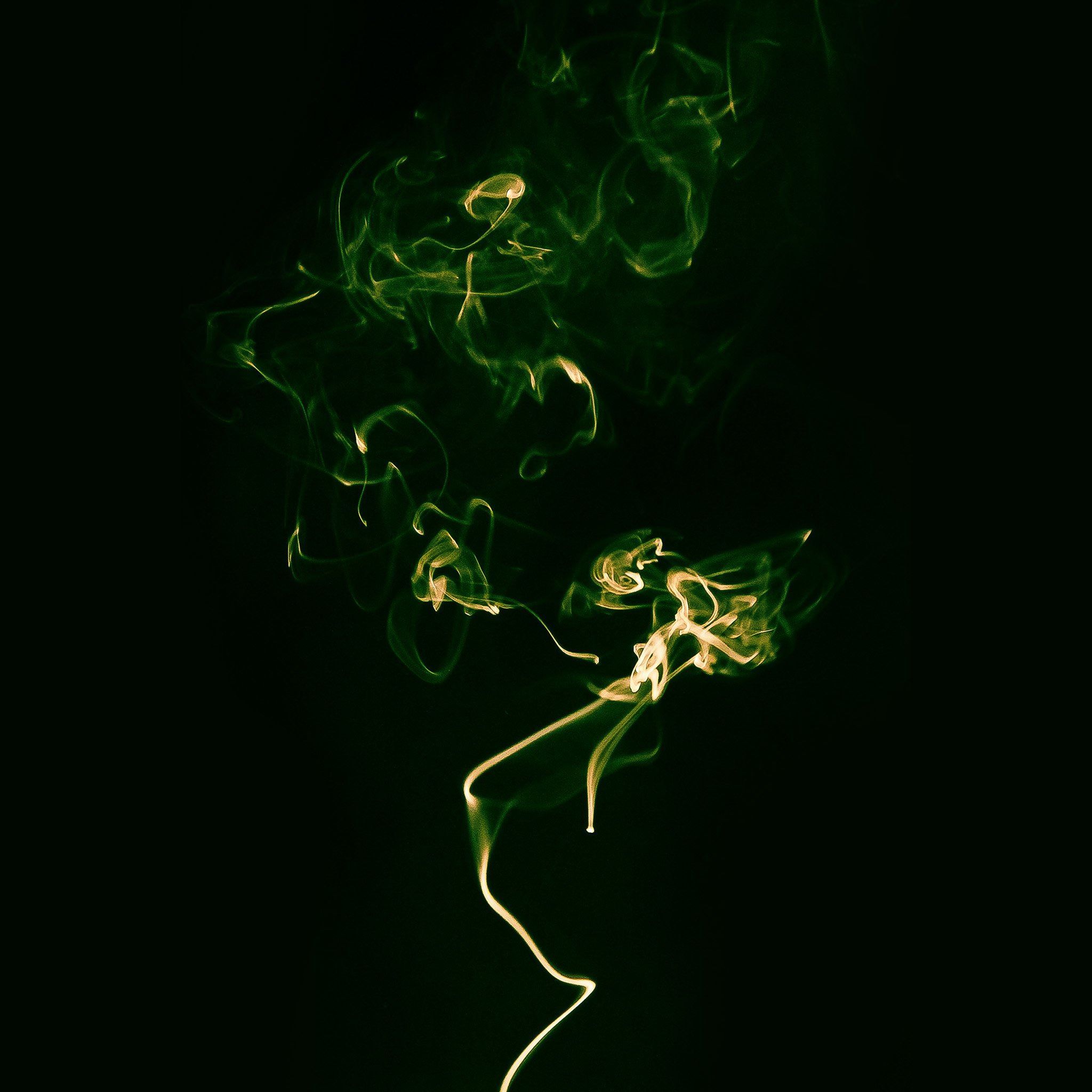 A green and gold photograph of smoke rising against a black background - Green, dark green