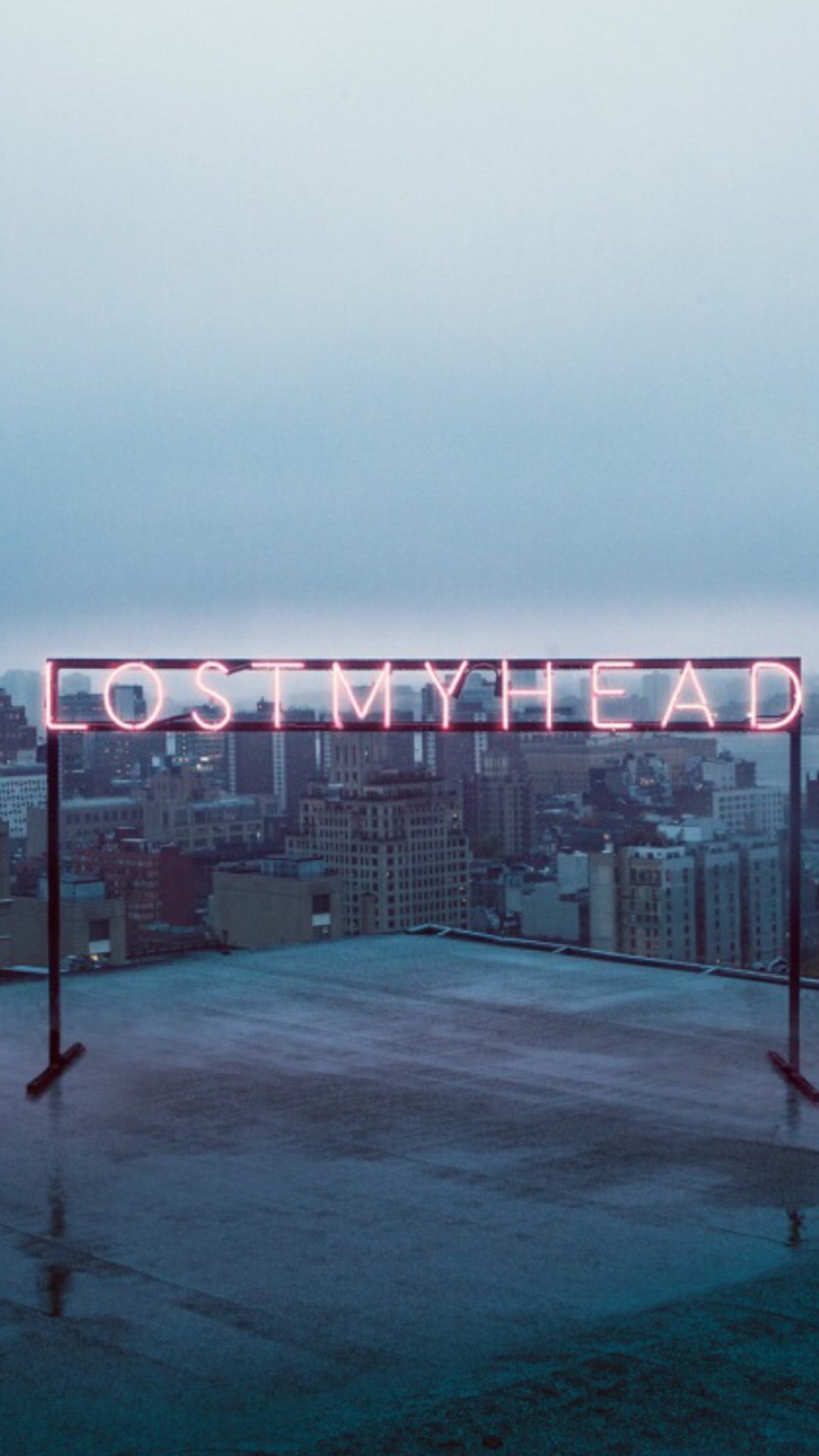 A neon sign that says lost my head - IPhone