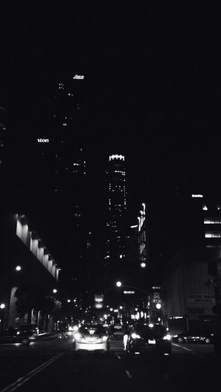 A black and white photo of city lights - Dark