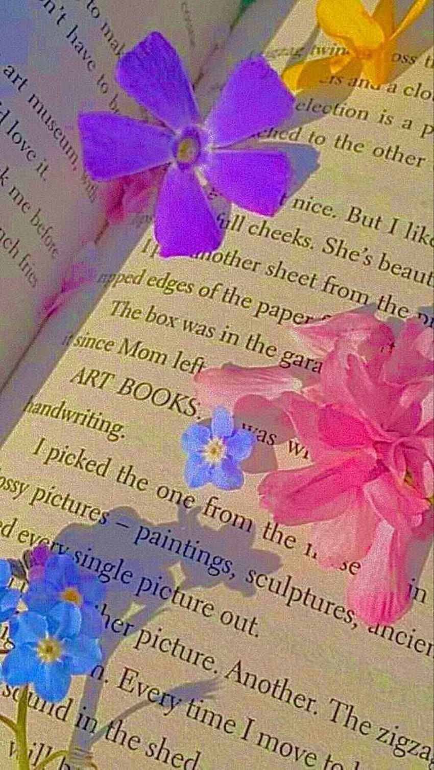 A book with flowers on the pages - Indie