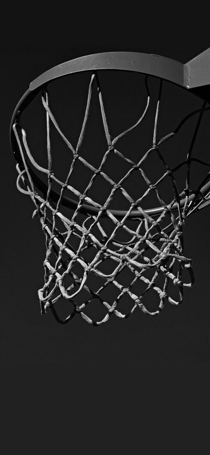 A basketball hoop with a net. - Basketball