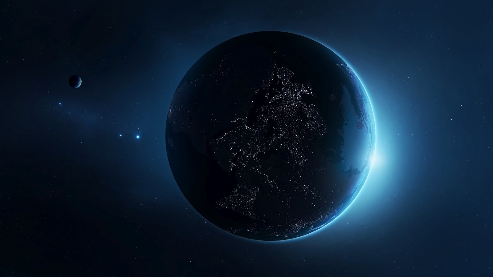 A planet in space with city lights on - Earth