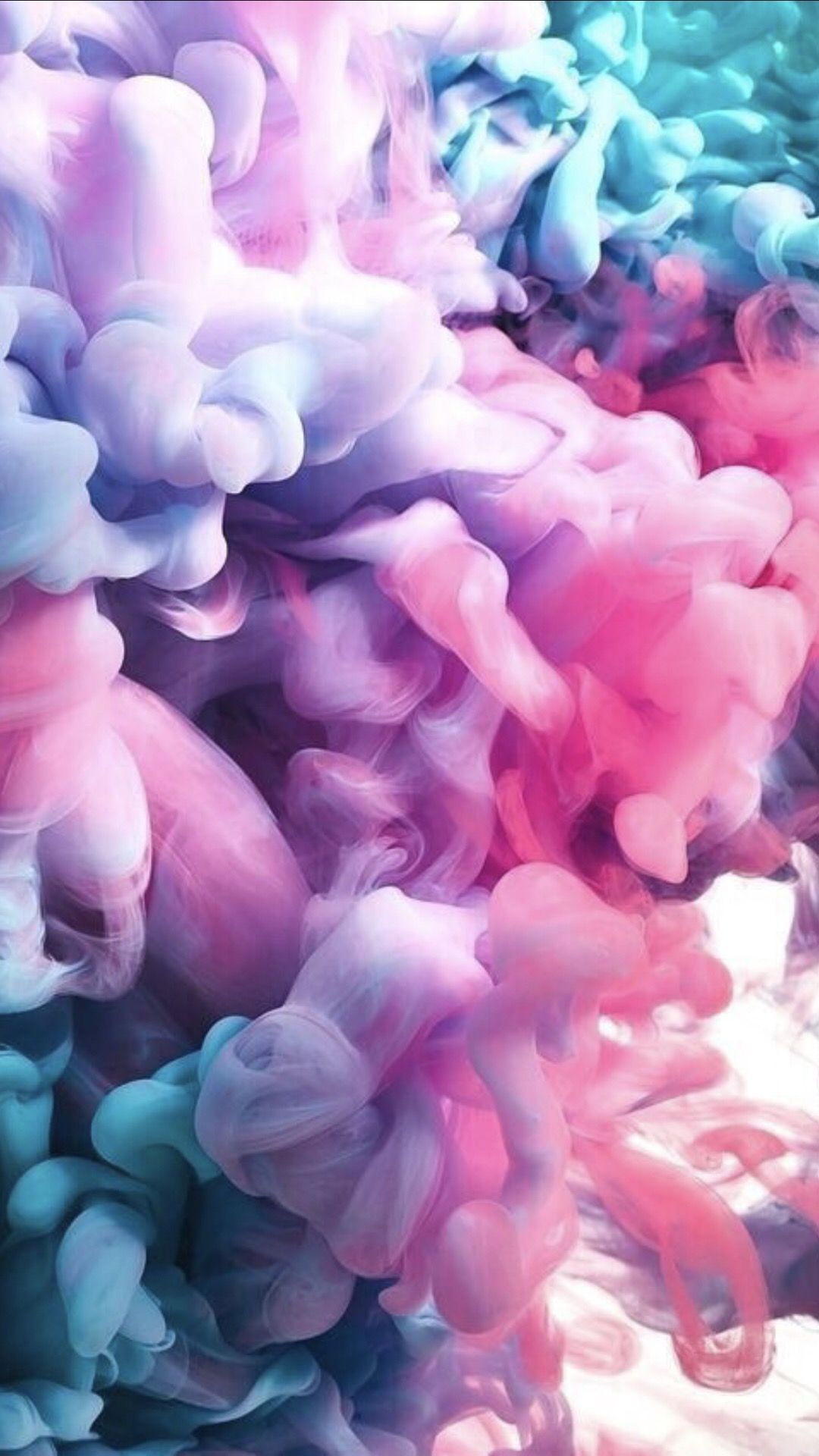 A close up of pink and blue ink - Smoke, candy