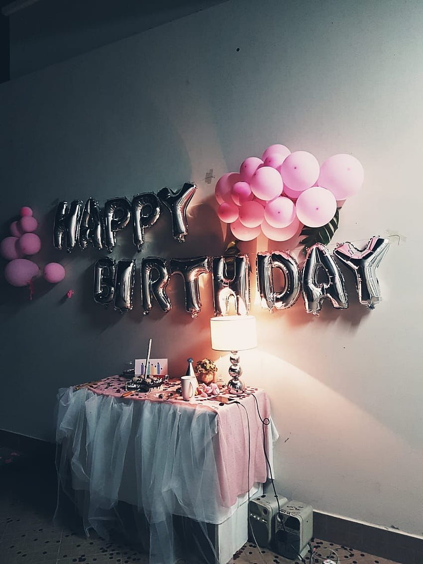 A table with balloons and decorations on it - Birthday