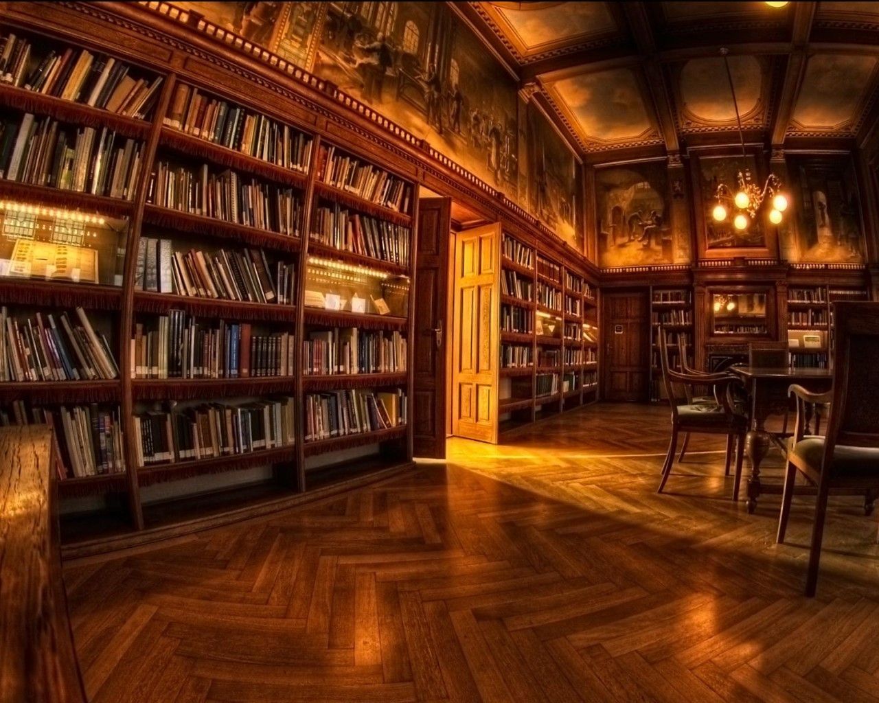 A library with wooden floors and bookshelves. - Library