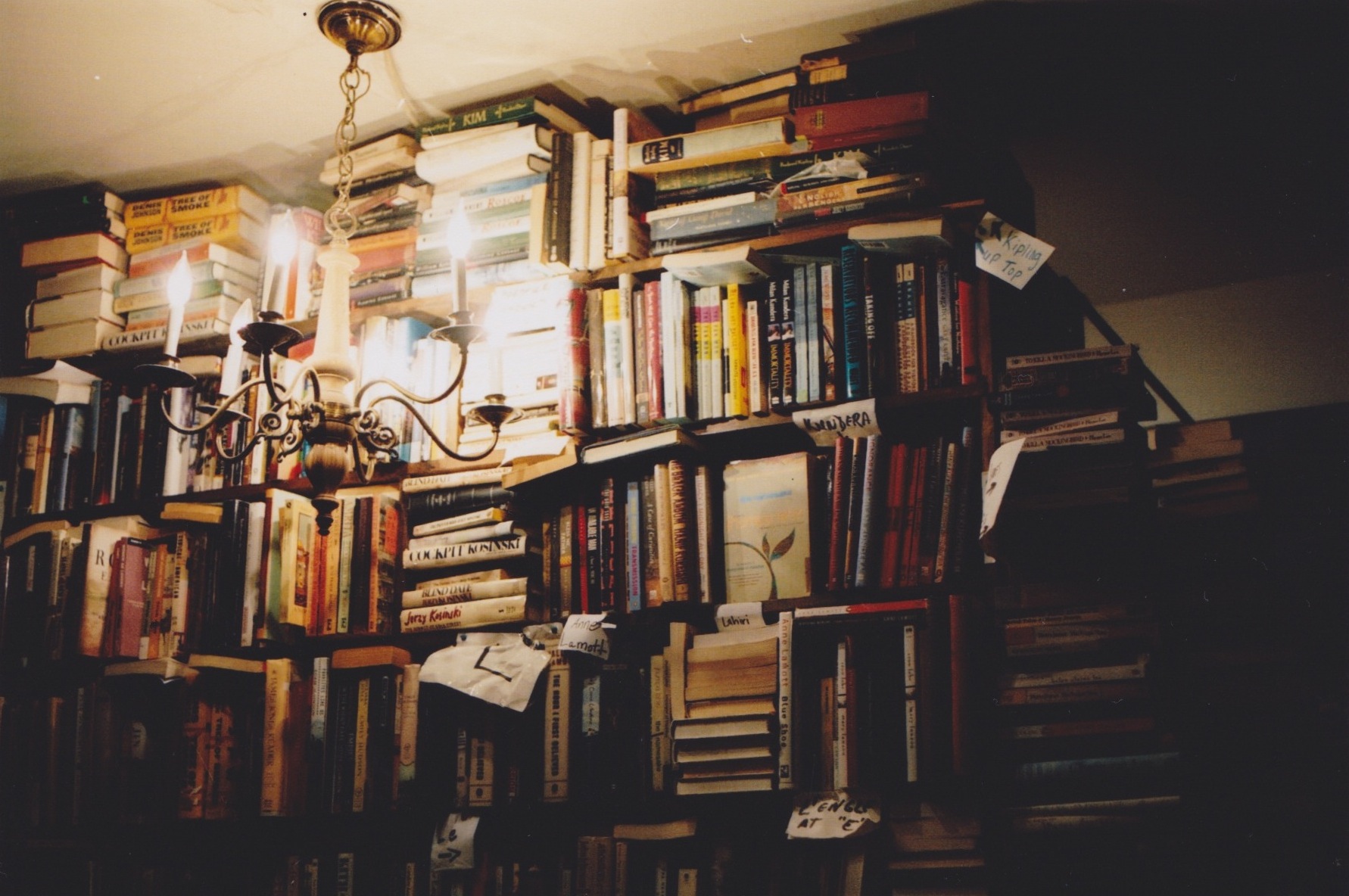 A book shelf with many books on it - Library